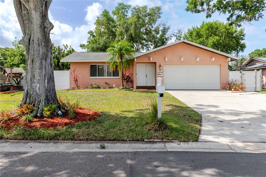 Welcome to 2276 Tamarron Terrace, a beautifully maintained 3-bedroom, 2-bath home situated on a desirable corner lot in the heart of Palm Harbor. This warm and welcoming home features a spacious living room, dedicated dining area, and an updated eat-in kitchen with stainless steel appliances and a bar-style countertop perfect for casual dining.Sliders from both the primary bedroom and dining area lead into the expansive screened Florida room, a standout feature offering versatile indoor-outdoor living space to relax and enjoy Florida living year-round.
The private fully fenced backyard offers plenty of room for entertaining, grilling, gardening, pets, or simply soaking up the Florida sunshine. The 2-car garage provides added storage and convenience.
Conveniently located across from the Palm Harbor Library and Palm Field Park, this home is just an easy ride to Honeymoon Island State Park, Gulf beaches, downtown Dunedin, shopping, restaurants, and the Pinellas Trail. Located within the highly sought-after Palm Harbor school district, this home offers the perfect opportunity to enjoy the Palm Harbor lifestyle in a centrally located neighborhood.