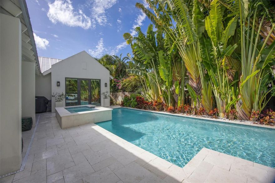 Step into Luxury and Privacy in this Premiere West of Trail location! Beautifully designed and appointed, the contemporary Susan Hritz custom designed home evokes the best of Florida living. As you enter this extraordinary residence you are drawn to the natural beauty of tropical landscaping and stunning travertine patio in your private courtyard overlooking a sparkling heated pool and spa, viewed from your expansive great room, kitchen and owners' suite designed for quiet relaxation and entertaining family and friends. A perfect blend of indoor and outdoor living, this wonderful home located on a quiet cul-de-sac boasts 2551 sq. ft., vaulted and cathedral ceilings, expansive impact glass doors and windows, 3 bedrooms, 3.5 baths, bonus room and distinctive great room design. The exquisite interior finishes include European oak floors, shiplap cathedral ceiling, quartz counters and upscale lights and fixtures combined with beautiful owner appointments for transitional appeal. Chef inspired kitchen features quartz counters, single level island with breakfast bar for casual dining, Wolf gas cooktop, built in oven and steam oven, Asko dishwasher, Sub-Zero side by side refrigerator and optimal walk-in pantry.  Elevate your entertaining with the chic dry bar featuring convenient built-in wine rack, upper and lower cabinets and Sub-zero wine refrigerator, a perfect addition to your dining area open to the great room with sliders to your beautiful courtyard and pool. Retreat to the wonderful owners suite with gorgeous courtyard vistas and door to the exterior, sitting room with access to the rear yard, spacious built-in closet, deluxe soaking tub, shower with rain shower head and dual bowl vanity. Spacious 2nd floor bonus room, ensuite guest bedroom and bath and 3rd bedroom and hall bath provide privacy for all. Generous laundry room with new stackable LG washer and dryer, dual zone HVAC, newly added spa with gas heater and pump, security system, outdoor lighting, 2 car garage and fenced yard complete this exceptional residence. Built to current codes with metal roof and impact doors and windows for your peace of mind provides savings on homeowners insurance. A quiet sanctuary situated in the desirable and charming Southside Village neighborhood with exceptional surroundings includes Morton's Gourmet Market, boutique shopping and diverse dining options. You are just minutes to Sarasota's vibrant downtown, art galleries, performing arts venues, beautiful bayfront setting, acclaimed restaurants, shopping on St. Armand's Circle and our gorgeous Gulf Coast beaches!