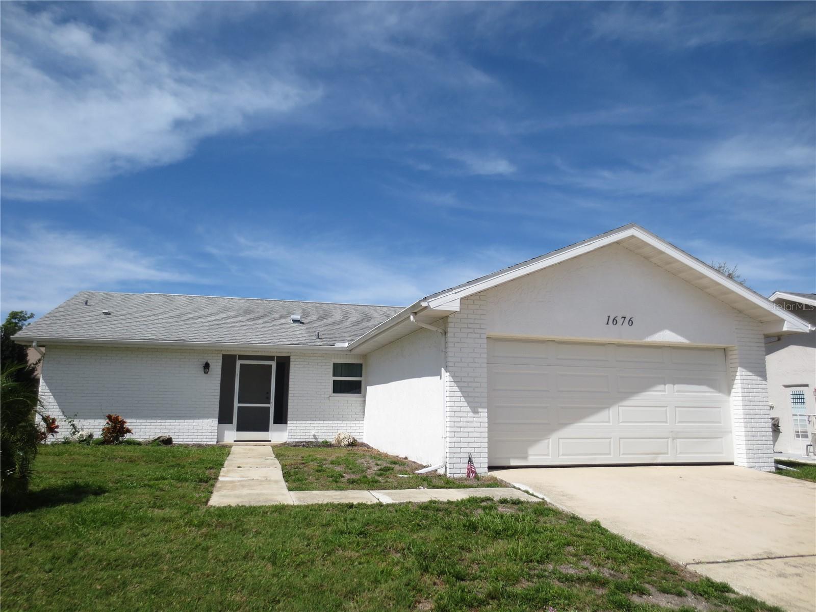 Highland Lakes community offering tons of activities to include olympic sized pool, hot tub, no greens fee 27 hole golf course, bocce, tennis, shuffleboard, club house, auditorium, dinners & dances, wood shop, ceramics & art studio, RV & boat storage and access to Lake Tarpon. Immaculate single family, one story, 2 bedroom, 2 bath, 2 car garage home completely renovated with hurricane rated impact windows, skylights in living room, all new kitchen with all new high end appliances, granite countertops, water softener, ceiling fans in all rooms, rear enclosed porch with wall pack AC and laminate flooring throughout. Situated near schools, churches, shopping centers and major thoroughfares.