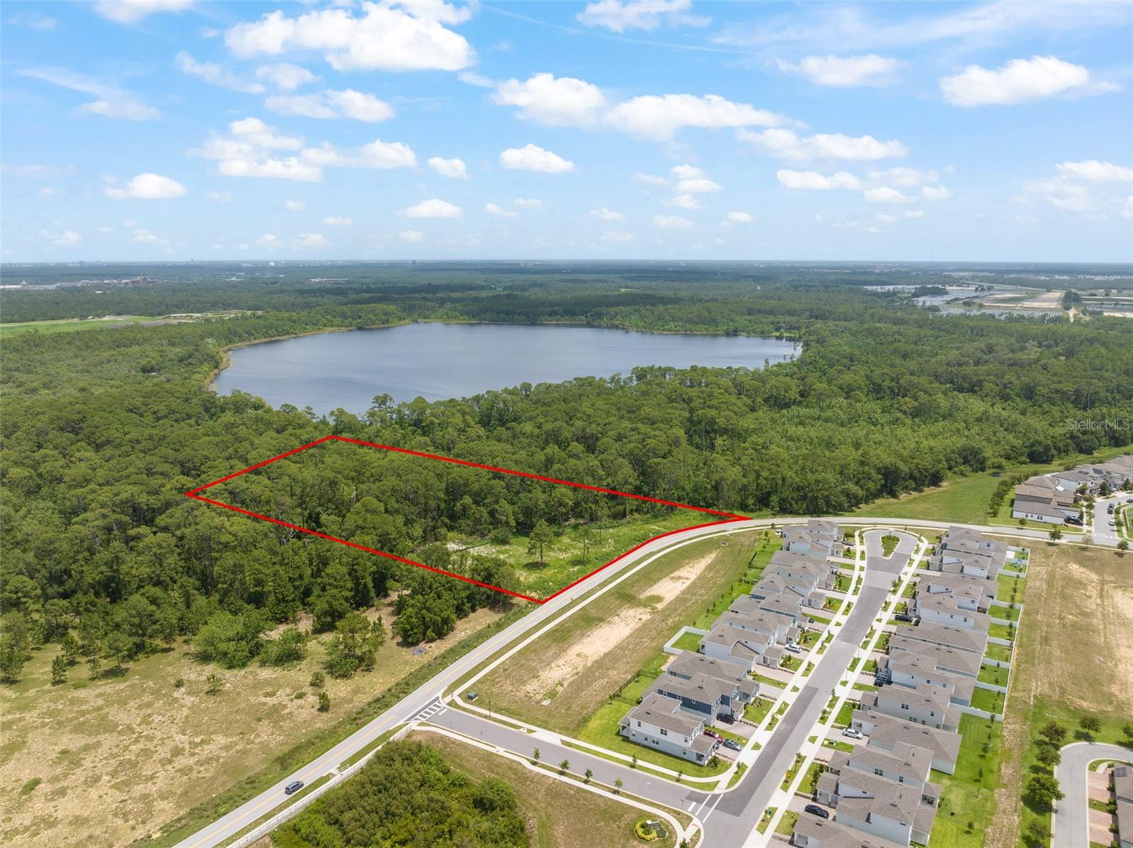 Seize the opportunity to own a prime piece of land in the rapidly growing Horizon West area. This ideally located property is within walking distance of top-rated schools and is zoned accordingly. It’s also a short walk to brand-new commercial developments including Starbucks, New York Beer Project, Walgreens, and more. Just a quick drive away, Hamlin Town Center offers a state-of-the-art cinema, Publix, and fine dining options. And this is only the beginning—Horizon West continues to evolve, with exciting new projects like the $45 million surf park planned for Avalon Road. This property borders Disney property and offers future owners the rare ability to enjoy nightly Magic Kingdom fireworks right from their backyard. The parcel includes 2.86 acres of land ready for development. Savvy investors may consider pursuing wetland mitigation credits to potentially increase the developable acreage by approximately 4 acres. Currently zoned A-1 Agricultural, the property lies within Village F of Horizon West, a designated growth sector. While buyers should confirm zoning and density requirements with Orange County, some developers view this site as a strong candidate for townhomes or single-family homes under a Planned Development (PD) designation. Don’t miss this rare opportunity to invest in one of Central Florida’s most dynamic and desirable markets.