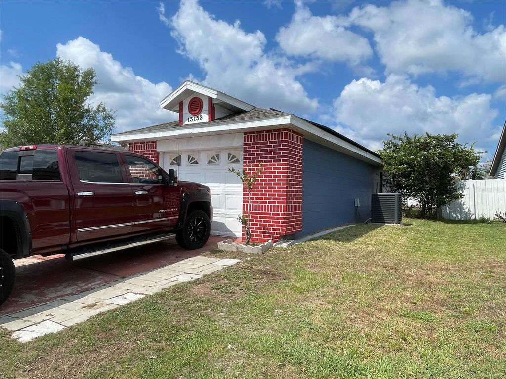 Photo of 13132 Phoenix Woods Lane, Orlando, FL 32824 (MLS # O6402713)