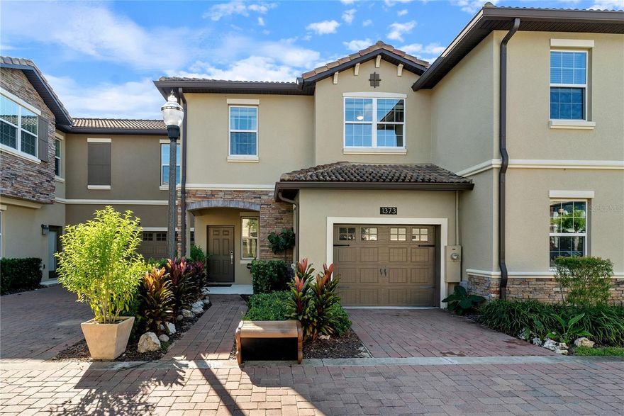 Welcome to your brand-new staycation in this luxurious townhouse located in The Trails at the Vistas, ChampionsGate's newest and most exciting community! This beautifully designed home features three spacious bedrooms and two-and-a-half bathrooms, offering the perfect blend of comfort and sophistication. Step through the covered entry into an elegant dining area that seamlessly flows into a spacious great room, ideal for entertaining or relaxing with family. The open-concept kitchen overlooks the living space, creating a bright and airy atmosphere. Step outside to the private lanai, the perfect spot to unwind and enjoy the tranquil surroundings of this scenic community. This home is a golfer's dream-and nature lovers will appreciate the abundance of green space and trails nearby. Downtown ChampionsGate has it all include upscale dining and shopping, all just minutes away. Located close to Walt Disney World, the Omni Hotel & Resort, International Drive, and I-4, this home offers unmatched convenience, entertainment, and lifestyle options right outside your door. Whether you're looking for a full-time residence, second home, or investment property, this is your opportunity and it won't last!!