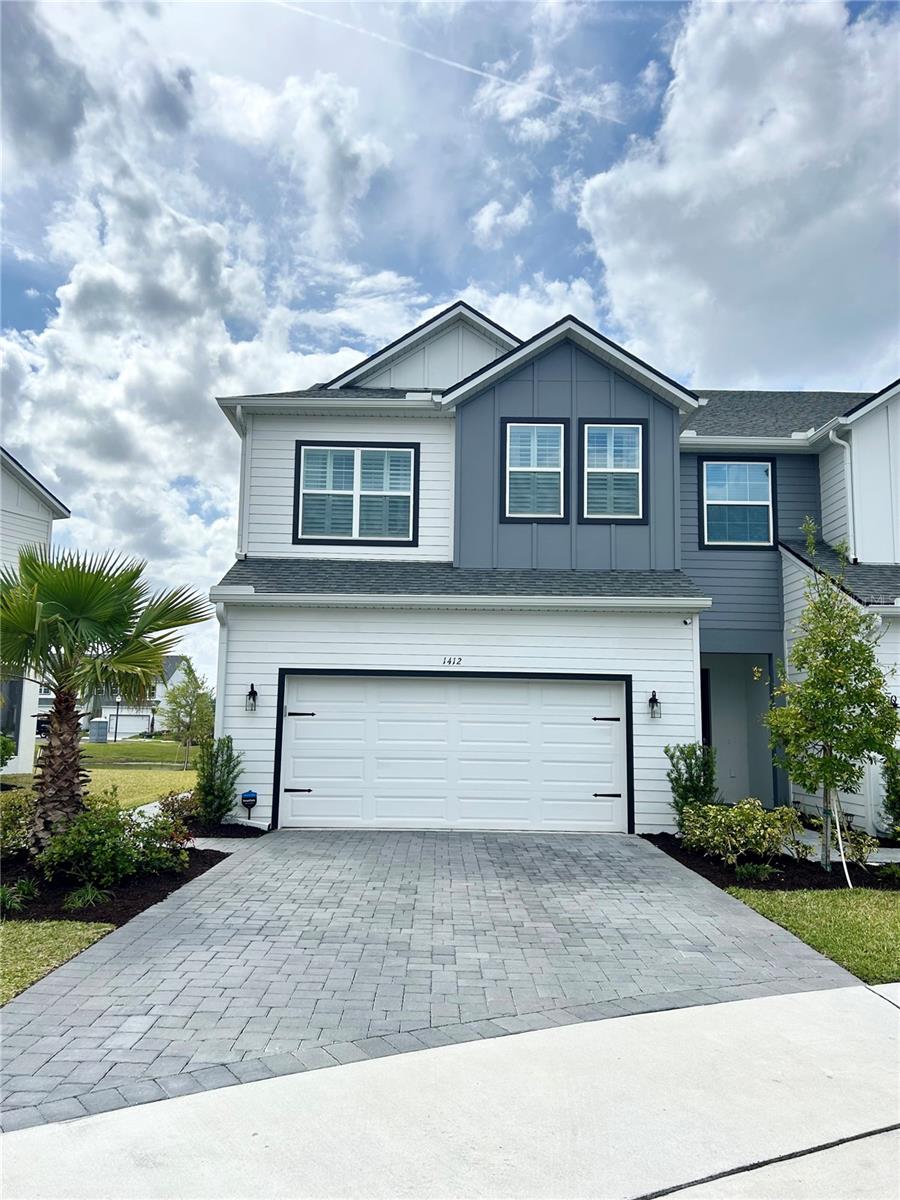 Contemporary 2023-Built Townhome with Pond View in Oviedo!
Step into 1412 Brookdale Ct, a beautifully designed 3-bedroom, 2.5-bathroom townhome constructed in 2023, spanning 1,940 square feet in the heart of Oviedo. Positioned on a prime cul-de-sac lot with a scenic pond view, this 2-story home offers an airy open-concept layout, enhanced by expansive windows with plantation shutters that invite natural light and frame the peaceful water vista. The chef-inspired kitchen features 42-inch upper cabinetry, premium Moen faucets, and a spacious island with pendant lighting, flowing effortlessly into the living and dining spaces—ideal for gatherings.
Accessible via double French doors, the covered patio overlooks the pond, providing a serene setting for conversation against a natural backdrop. Upstairs, a flexible loft space is perfect for a home office, quiet retreat, or workout area, complemented by a primary bedroom with a large walk-in closet. An upstairs laundry room and abundant storage add practicality. The home showcases Mohawk carpet and tile flooring, high ceilings, recessed lighting, vinyl insulated Low-E double-pane windows, upgraded R-30 ceiling insulation, and energy-efficient systems including a 16-SEER air handler and A/C heat pump for cost-saving comfort. Built to enhanced hurricane-resistant standards, this home ensures durability and peace of mind.
The property includes a 2-car garage, paver driveway, and access to a gated community with exclusive amenities, such as a quaint meadow featuring a bench and shaded structure for relaxation. Just a short walk from two top-tier schools in an exceptional school district, Brentwood Landing is ideally located near Highway 417 (Central Florida Greeneway), providing easy access to Sanford, Oviedo, the University of Central Florida, east Orlando, and Kissimmee. It’s only 5 miles from UCF and a quick 23-minute drive (17 miles) to downtown Orlando, with Oviedo on the Park, shopping, and dining nearby. This townhome combines modern sophistication with an unbeatable location. Schedule your private tour today!
