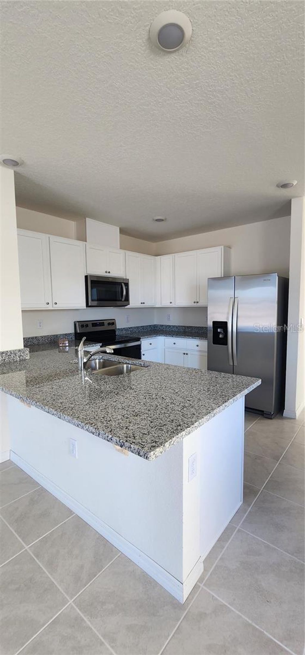 Photo of 565 Park Place Boulevard, Davenport, FL 33837 (MLS # S5138912)