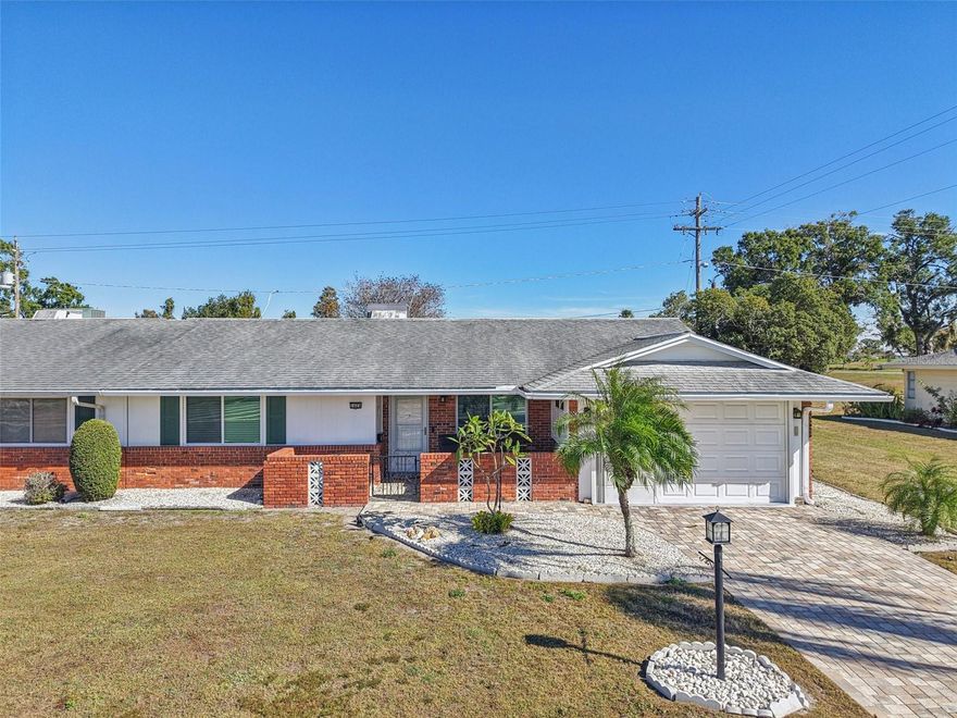 Move-In Ready & Maintenance-Free Living in Sun City Center!
Discover this cozy 2-bedroom, 2-bathroom villa with a 1-car garage nestled in a desirable Sun City Center community. Enjoy an incredibly low monthly HOA fee that conveniently includes lawn care and water, giving you more time to relax! Step onto the charming covered front porch and into the spacious great room. The flow leads seamlessly into the kitchen and out to the bright, oversized Florida Room—perfectly utilized as a dining and secondary living area, bathing in natural light from the abundance of windows.
Both bedrooms are generously sized; the Primary Suite features a private ensuite with a walk-in shower. The second good-sized bedroom is steps from the full guest bath. Outside, mature landscaping adds curb appeal, and you'll love the privacy as it currently backs up to no backyard neighbors! 
You’ll love Sun City Center with its amazing facilities, pools, and clubs just waiting for you to enjoy. Nestled between Sarasota and Tampa, this location offers a convenient ride to airports, great shopping, dining, and professional entertainment. With easy access to award-winning, sandy beaches, this home provides the best of all worlds without the stress of big city life. Leave it all behind and enjoy your new life here in one of Florida’s most affordable 55-and-better communities!