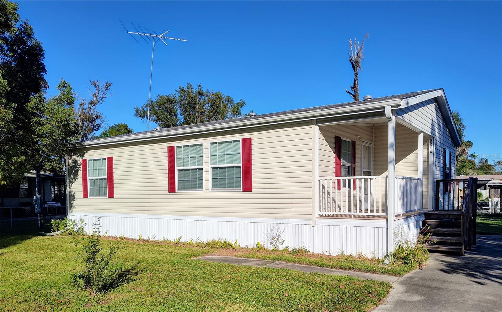 Just reduced!! Don't miss out on this 2018 manufactured home with 2 bedrooms 2 baths with all the appliances, W/D, and furnishings included!! Move right in and enjoy river life!! Chain-link fence for furry friends and a covered boat house and aluminum sea wall, on a nice deep canal leading to the St. John River. Storage shed for all you extra needs. On a paved road, in a golf cart community, with city water and sewer, No HOA, Perfect for a year round home or a weekend get away. Great location in a peaceful river town, but within an hour of Ocala & Daytona Beach!!