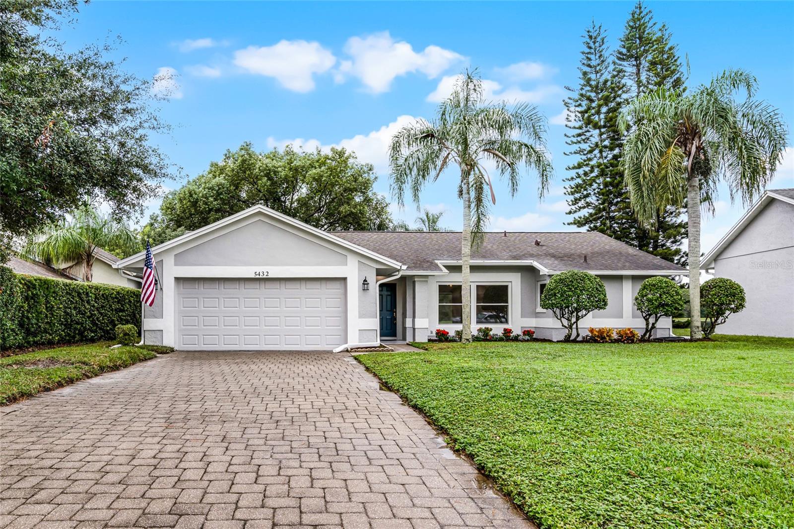 Great opportunity to own this fully remodeled home in the cozy community of Deer Creek Village. No detail has been overlooked in this three bedroom two bathroom split floor plan home with newer roof. Approaching the home you will appreciate the refreshed landscaping to include a new irrigation system that pumps from the lake, keeping your water bills to a minimum. This open and airy floor plan is loaded with natural light shining through the brand new double pane windows throughout. The foyer leads to a spacious living room and L'Shaped dining area. The kitchen is equipped with all new appliances and nutmeg cabinets and opens to a separate family room with vaulted ceilings and plenty of space to spread out. Doing the dishes is even a delight as you look out an oversized window with serene lake views. The Primary bedroom has brand new carpet and an ensuite bath with new vanity and toilet and an oversized walk-in shower and closet. The two additional spacious bedrooms also have brand new carpet and plenty of closet space. Secondary bathroom has also been outfitted with a new vanity, toilet and lighting. The remainder of the home is outfitted with new luxury plank flooring. There are new remote ceiling fans throughout, as well as led light fixtures. The fresh interior paint, and new knock down ceiling texture offers a modern and sleek look. Also, please note the entire home has been re-plumbed, new exterior paint, complete exterior gutters, HVAC is 2021, new garage opener and utility sink. There are multiple sliding glass doors that lead to the screened lanai with show stopping views! There is a spectacular uninterrupted view of the tranquil lake with 100's of acres of protected wetlands beyond. No rear neighbors. This is a paradise for the naturist enthusiast. Enjoy deer, turkey, otters, ducks and countless species of birds daily. Evenings can be spent enjoying the sunset over the water, stretching a hammock between the two tropical palms or place a firepit on the pavers in the backyard on those chilly days. Deer Creek Village offers a clubhouse, community pool, tennis courts, two basketball courts, playground, grassy area for sports and a community garden. Lowest HOA fees in the area and fences are allowed with approval. Situated 1 mile to Publix shopping center, 2.5 miles to Sea World, 15 minute to the International airport and Universal Studios and Disney attractions and Downtown Orlando are a short 20 minute drive. This Village is a hidden gem, close to everything, yet peaceful and quit.. Call today for a private showing, this one will not last.