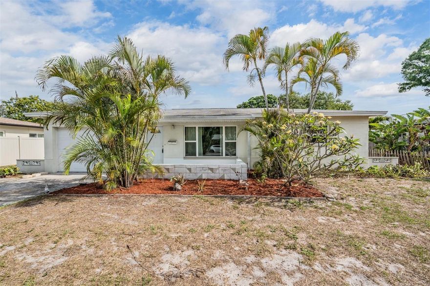 Large two-bedroom home in St. Petersburg!  This home features 2 bedrooms, 2 bonus rooms, 1 bathroom and a 1-car garage.  The floorplan allows for the two bonus rooms to be used as an additional family room/den and office, or you could use them both as additional bedrooms (see attached floorplan in photos).  Terrazzo flooring throughout.  This home needs updating but the A/C is also 2025!  1-car garage with an extra wide driveway.  Fenced rear yard.  This home is a must see and a pleasure to show!