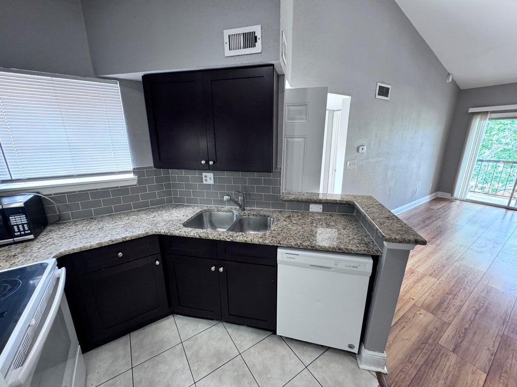 Photo of 1916 Lake Atriums Circle #33, Orlando, FL 32839 (MLS # O6434616)