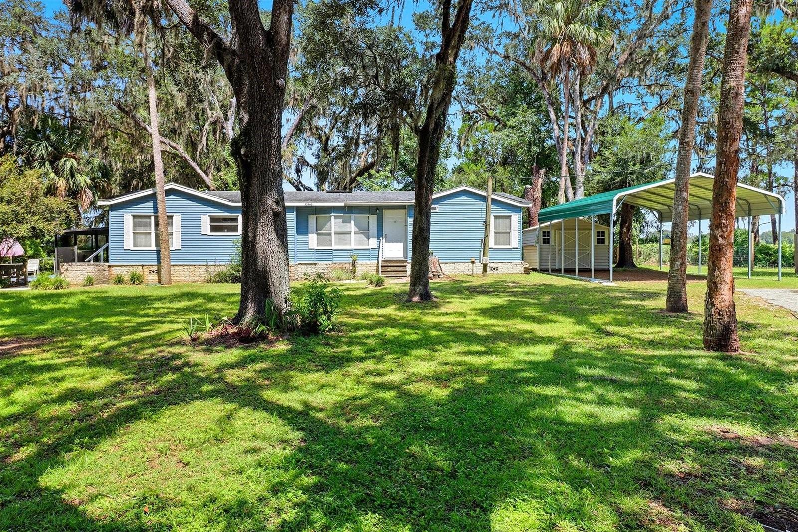 Welcome to River Retreats! This very nice home is located in the highly sought-after community and comes with deeded access to the community boat ramp on the historic Withlacoochee River for bringing all your water toys. The home offers a newer roof and HVAC system, bamboo flooring throughout, three oversized bedrooms each with its own walk-in closet, a separate formal dining room along with a dinette off the kitchen, and a spacious 12x18 screened patio. Sitting on a fully fenced double lot, the property also includes an 8x12 shed for storage and a brand-new pole barn providing covered parking for your vehicles or boat. There is truly nothing left to do here but move in and start enjoying the Florida lifestyle!