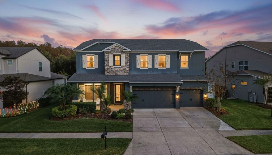 One or more photo(s) has been virtually staged. Set within the gated enclave of Sabal Point in Seven Oaks, a scenic approach guides you through manicured grounds and distinguished residences until you reach 4094 Windcrest Drive. The mature landscape, stone-accented façade, and inviting front porch create an immediate sense of refinement. Approaching the wood-framed glass door with its intricate metal inlay offers a glimpse of the elevated design that awaits inside. Stepping into the foyer, cascading natural light fills the space, drawing attention to the wood plank tile flooring, tray ceilings, crown molding, detailed trim work, and recessed lighting found throughout. Just off the entry, double French doors open to a dedicated office—ideal for work or study. Continuing forward, the formal dining space—enhanced by architectural columns—sets the stage for memorable gatherings. Nearby along this same hallway, the laundry room features a utility sink and spacious closet, and just beyond it sits a substantial storage area complete with granite countertops. The kitchen stands as a culinary showcase, anchored by a large island with overhang seating, recessed lighting, solid wood cabinetry offering abundant storage, granite countertops, double ovens, stainless steel appliances, a coffee or dry bar nook, and a generous walk-in pantry. From here, the open layout transitions effortlessly into a sunlit dining alcove perfectly suited for a large table. The expansive living room features custom accent walls and pocket sliding glass doors that frame views of the outdoor retreat. Just beyond, a remodeled full bath and a private bedroom create an ideal space for visiting guests. Ascending the staircase, an elegant landing welcomes you to the second level, where the primary suite opens as a true sanctuary of light and space. Tray ceilings, expansive windows, and two oversized walk-in closets enhance the feeling of refined comfort. The primary bathroom offers a luxurious retreat with a dual-sink vanity, soaking tub, and an expansive glass-enclosed walk-in shower. Three additional well-appointed bedrooms, two full bathrooms, and a remarkably spacious sixth room—perfect as an entertainment area or additional bedroom thanks to its large closet—complete the upper level. Outdoor living reaches new heights in the screened lanai, designed for both relaxation and entertainment. Enjoy paver flooring, a heated saltwater pool and spa with app-controlled lighting, and a fully fenced yard backing to a tranquil conservation area—an ideal setting for alfresco dining or hosting gatherings. Notable Highlights: Roof (2012) • AC #1 Downstairs (2025) • AC #2 Upstairs (2012) • Water Heater (2023) • Interior Painting: Foyer, Kitchen, Living Room & Downstairs Hallway (2025) • Cabinet Hardware (2025) • Pool Pump (2024) • Pool Heater (2019) • Pool Resurfacing (2019) • Carpet (2023) • Tile (2017) • Bathroom Remodel (2017) • Crown Molding & Trim Work (2015) • Backsplash (2025) • Front Door, Pavers & Flooring (2018) • Fence (2017) • Water Softener, Pool & Pool Cage (2013) • Garage Door Opener (2024) All that Seven Oaks features includes pools, a fitness center, splash areas, sports courts, fields, a park, and a clubhouse with gathering spaces, theater, and café. Nearby shopping and dining include The Shops at Wiregrass, Tampa Premium Outlets, and local favorites, with top-rated medical facilities close by. This isn’t just a house—it’s a place to call home. Schedule your private tour today! Click link for virtual tour.