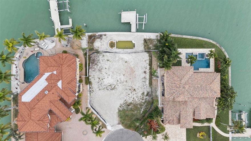 Welcome to an extraordinary opportunity to build your dream waterfront estate on one of the most coveted streets in Treasure Island. Located at the end of a private cul-de-sac, 850 Capri Boulevard offers a rare 100’ x 120’ waterfront lot with breathtaking, uninterrupted panoramic views of the Intracoastal Waterway in every direction. This exceptional homesite delivers the perfect blend of privacy, prestige, and open water beauty—an ideal setting for a custom luxury residence designed to maximize the spectacular surroundings.

A true boater’s paradise, this prime property features direct, deep-water access with the Gulf of Mexico just minutes away by boat, making it effortless to enjoy world-class boating, fishing, and waterfront dining. Wake up to shimmering sunrises, enjoy dolphin and manatee sightings, and unwind each evening with glowing sunsets over the water—all from your own future backyard oasis.

With its unparalleled location, generous dimensions, and commanding water views, this is a once-in-a-lifetime opportunity to create a legacy property in one of Treasure Island’s most desirable waterfront enclaves. Build the home you have always envisioned and embrace the ultimate Florida waterfront lifestyle.