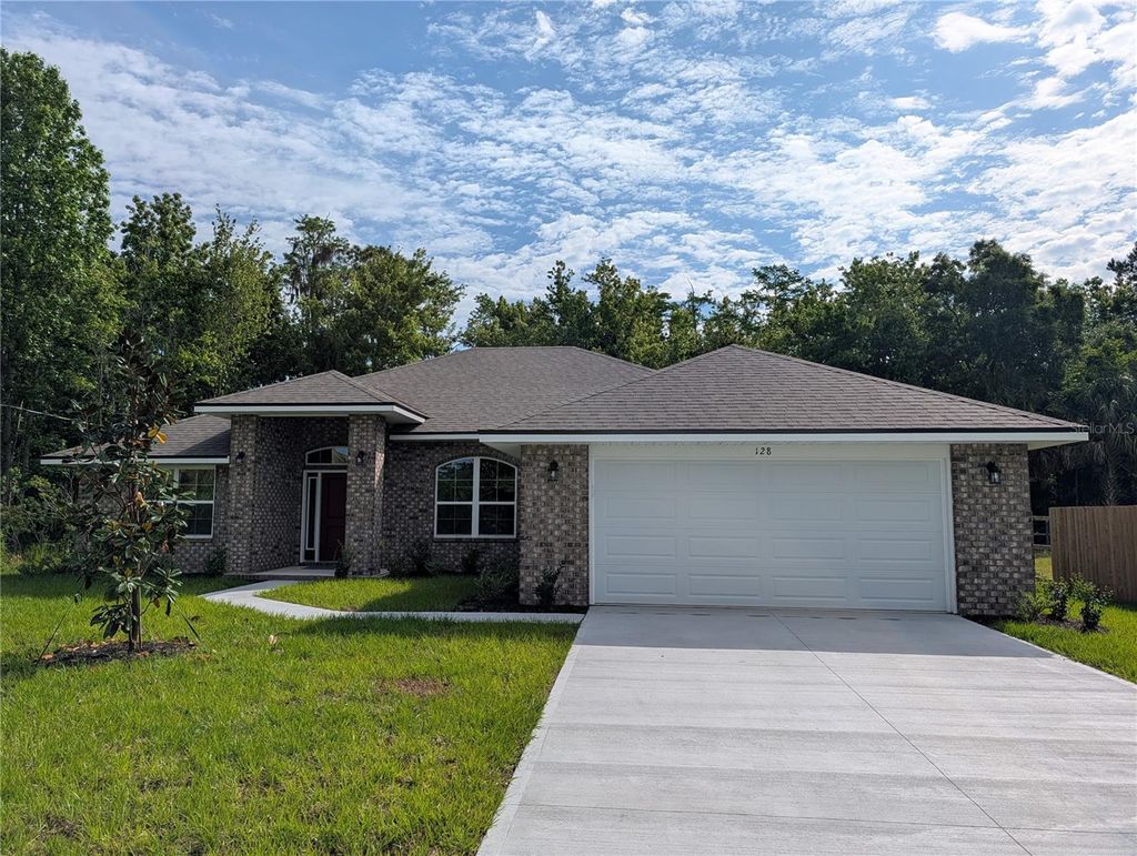 Photo of 128 Bird Of Paradise Drive, Palm Coast, FL 32137 (MLS # O6404093)