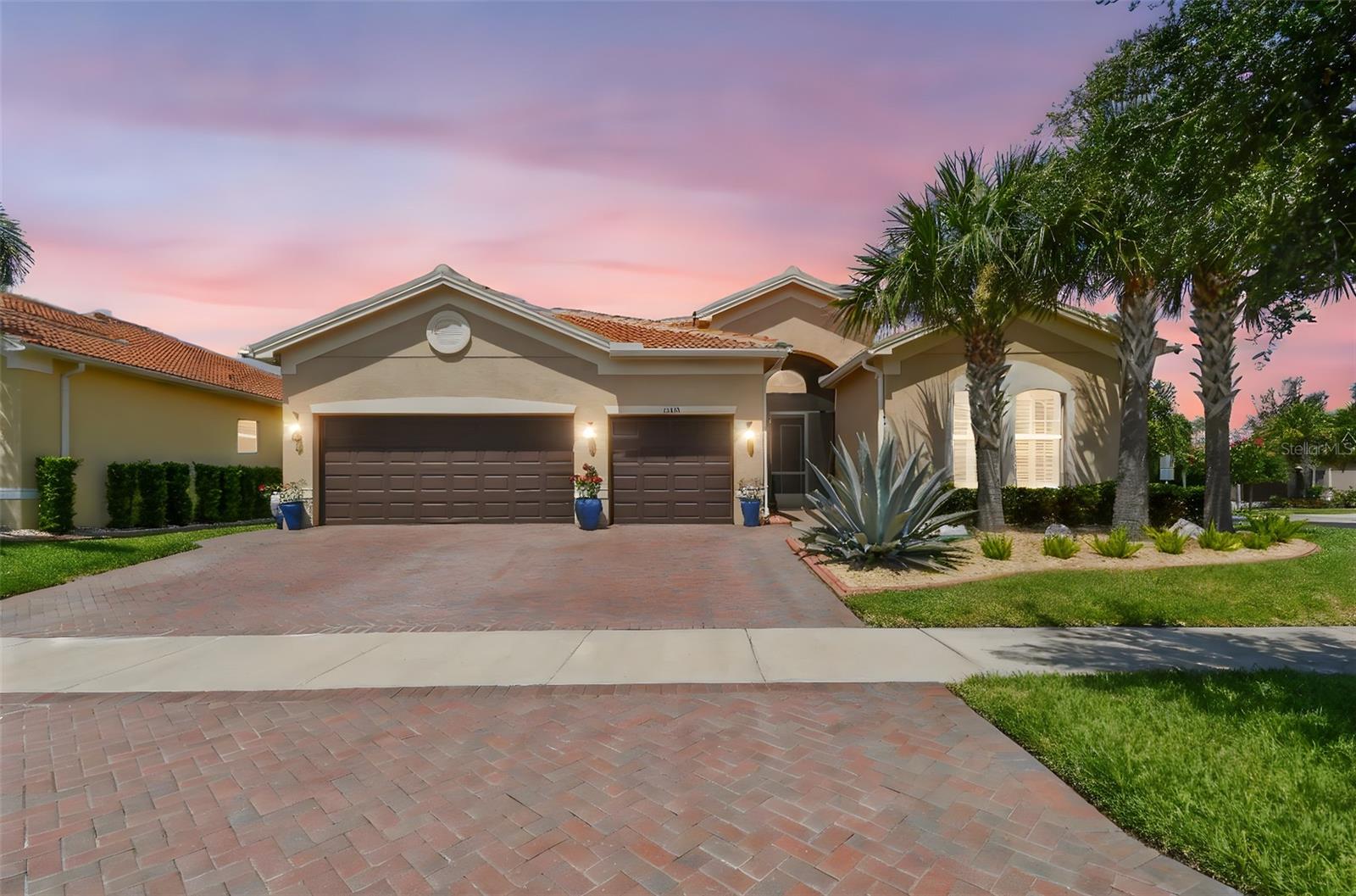 Exceptional Upgraded Home in Valencia Lakes-Premier 55+ Gated Resort Community Welcome to your dream home in Valencia Lakes, one of the most sought-after 55+ gated communities on Florida’s Gulf Coast. This beautifully enhanced 3-bedroom, 3.5-bath residence is the perfect blend of timeless design, thoughtful upgrades, and resort-style living. From the moment you arrive, you’re greeted by a widened driveway offering added convenience and curb appeal, framed by professionally designed low-maintenance stone beds with a concrete border and ambient landscape lighting. This meticulous attention to detail continues throughout the home, creating a move-in-ready experience. The open-concept living spaces are adorned with full house crown molding and elegant plantation shutters. The home was completely repainted and the house has tile throughout. The chef’s kitchen boasts quartz countertops, stainless steel appliances and upgraded wood cabinetry and opens gracefully into the main living and dining areas, ideal for both everyday comfort and entertaining. In the spacious primary suite, dual custom-built walk-in closets provide exceptional storage, while the ensuite bath features a luxurious frameless glass shower enclosure with extra-thick glass for a true spa-like feel. Function meets peace of mind with smart additions such as a 50-amp dual-fuel generator with a circuit box switch, a whole house water softener and kitchen sink water filtration dispenser, a whole-house surge protector, and a complete ADT cellular alarm system with intrusion, smoke, and glass-break detection. A high-definition exterior security camera system with Wi-Fi playback is also included, providing an extra layer of protection. Throughout the home, energy-efficient LED designer light fixtures add a warm, modern ambiance. Even the oversized garage has been thoughtfully upgraded with an epoxy floor, insulated garage doors and ceiling and its own air conditioning system, making it the perfect workshop or hobby space no matter the season. Beyond the property itself, residents of Valencia Lakes enjoy access to an extraordinary lifestyle. At the heart of the community is a 40,000 square-foot clubhouse offering a state-of-the-art fitness center, steam and sauna rooms, a grand social hall for concerts and events, and dedicated studios for art, crafts, and group activities. Outside, the amenities continue with a resort-style pool, lap and resistance pools, tennis and pickleball courts, bocce, shuffleboard, a dog park, community garden plots, walking and biking trails, and even a softball field. Golf carts are welcome throughout the neighborhood, adding an extra layer of ease to daily life. A full-time lifestyle director ensures the social calendar is always full, with more than 50 resident clubs ranging from travel and dance to arts, music, fitness, and lifelong learning. Whether you're attending a themed dinner in the ballroom, playing a morning match of tennis, or relaxing poolside with neighbors, Valencia Lakes makes every day feel like a vacation. Located just 25 miles south of Tampa, this gated community offers the perfect balance of privacy, activity, and convenience. Lawn care, irrigation, premium cable package and internet are included with the HOA, so you can spend more time enjoying all this vibrant neighborhood has to offer. With its premium upgrades, refined finishes, and access to one of Florida’s premier 55+ communities, this is more than just a home-it’s a lifestyle.