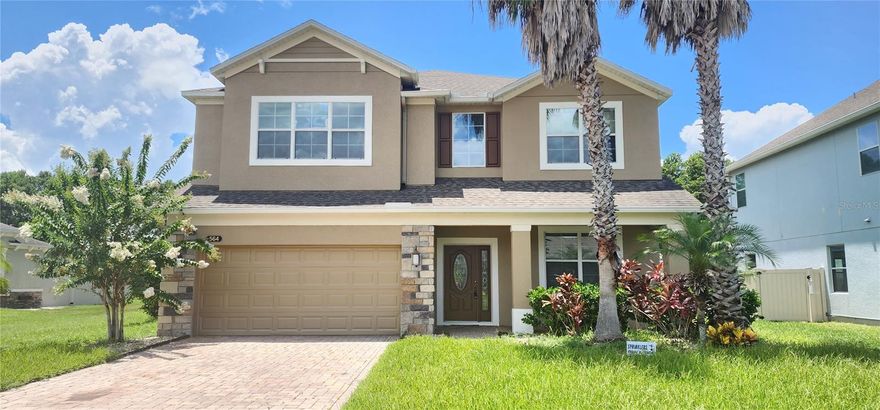 Back on the market! Hurry and do not miss the opportunity to own this beautiful home in the gated community of McCormick Woods. Conveniently located and one of the largest lots in the subdivision, featuring 5 bedrooms, 4 baths, huge loft, 3-car garages, brick paved driveway, front porch, and an extended covered lanai . Open floor plan flows from the entry to the great family room. Upgrades include a gourmet kitchen with 42" crown molded cabinets, raised granite countertops with a beautiful backsplash, cabinets with under-lighting, and a huge island. This beautiful kitchen is equipped with a double oven, range, recessed lighting, cabinets with glass doors, a huge pantry, and a dry bar. This stunning home comes with an intercom allowing you to communicate with anyone in the bedrooms, loft, patio, and front door. The main console is in the kitchen area. Use the CD player, or connect your phone to play music in every room, throughout the house, and on the outside patio. The Guess bedroom on the first floor has a full bath right next door. Enter the luxurious upstairs owner's suite bedroom through a French door to find a beautiful tray ceiling, large picture windows, an enormous walk-in closet, an owner's bath with a glass-enclosed walk-in shower, garden tub, and a double sink with raised granite countertop vanity. The 5th bedroom is shown as a master bedroom with its own bathroom. You also have the convenience of an indoor laundry with 42' cabinets and a folding table. Beautiful hardwood flooring throughout first floor, crown molding, loft wired for surround sound, and TV wall. McCormick Woods offers a community pool, playground, and sand volleyball court. This beautiful home is just minutes from 429, 414, I-4, shopping centers, and A-rated schools. All information must be verified by the buyer. Room sizes are approximate.