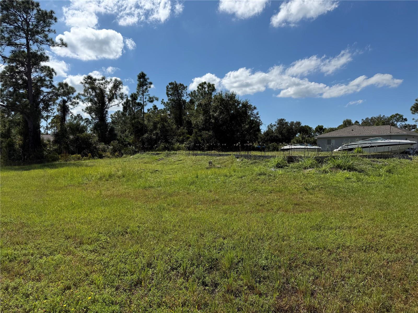 This ready-to-build lot offers the perfect head start on your Florida dream home! This property already has footers in place and available building plans ready to go — saving you valuable time and expense. Enjoy the flexibility of possible seller financing, making this an excellent opportunity for builders, investors, or future homeowners. Photos of a finished home in the same neighborhood show the stunning potential of this design and location. Don’t miss out on this rare find — a build-ready lot in beautiful North Port with easy access to shopping, dining, and Gulf beaches.