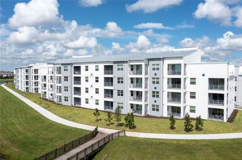 Photo of 3161 Paradox Circle #403, Kissimmee, FL 34746 (MLS # O6387522)