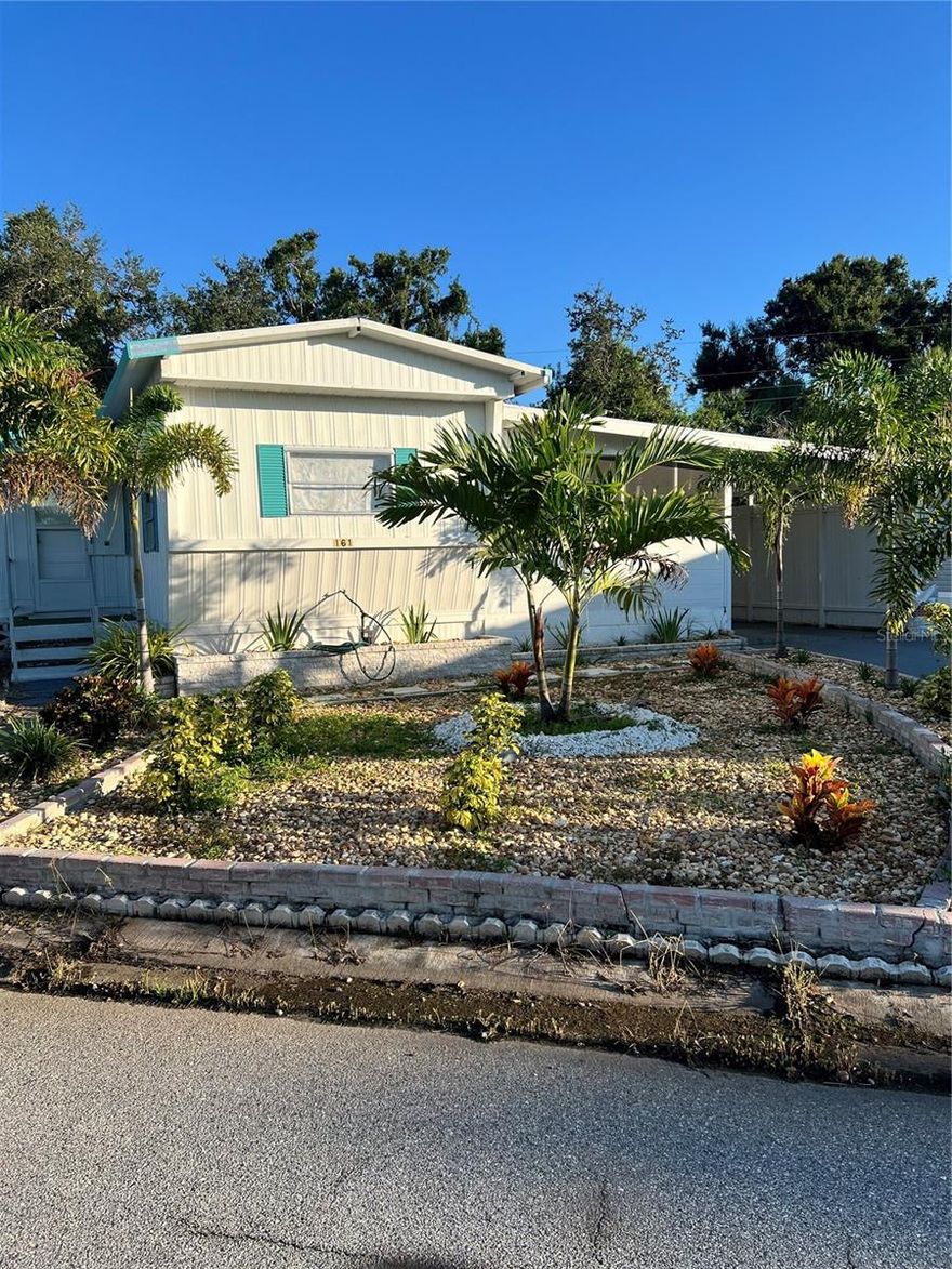 Beautiful updated double-wide home in Tri-Par Estates featuring a remodeled kitchen with upgraded cabinets, countertops, and tile flooring, plus a renovated bathroom with modern finishes. Additional features includes a bright Florida room, spacious living areas, and a covered carport with asphalt driveway. While many updates have been completed, the home still needs some finishing touches-making it a great opportunity to add your personal style. A personal laundry room with an additional shower is also in place and just needs some work to be finished. This property is also an excellent option for an investor looking to generate rental income, as leasing is permitted with board approval. Tri-Par Estates is a 55+ community with a heated pool, spa, fitness center, clubhouse, laundry facilities, and more. Annual park assessment includes internet, cable, trash, and full access to all amenities- with NO CDD fees. Conveniently located near shopping downtown Sarasota, Sarasota-Bradenton Airport, and world class beaches. Don't miss this opportunity to make this home yours!