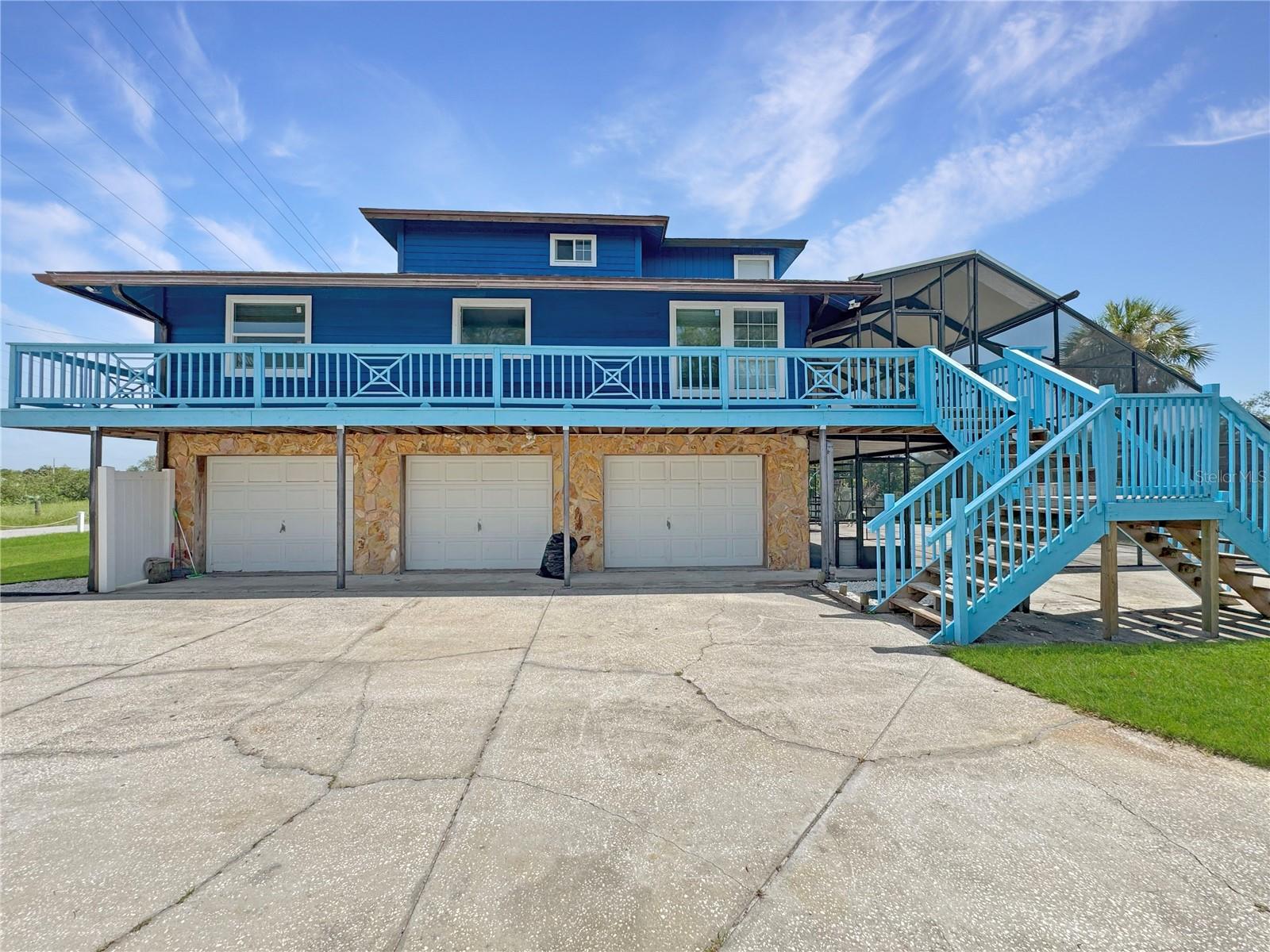 One or more photo(s) has been virtually staged. Welcome to this unique 3-bedroom, 2.5-bathroom home in the desirable Armstrong's Riverside Estates community of Gibsonton, FL — where boating, fishing, and coastal living meet comfort and convenience. With direct canal-front access to the Alafia River, leading into Hillsborough Bay and the Gulf Coast, this property is a rare find for outdoor and water enthusiasts. This home sits on over 0.36 Acres on a waterfront lot. The first floor has a spacious 3-car garage, half bathroom and ample storage. A large screened in porch is also found on the first floor facing the canal-front dock with gazebo, perfect for relaxing or entertaining. The main living area is located on the second level with vinyl wood flooring throughout, two well-sized bedrooms, a full bath & laundry room. The kitchen has stainless steel appliances, a wet bar, and generous storage. From the cozy living room, sliding glass doors open to a wrap-around screened porch overlooking the tranquil canal. The third floor hosts a private primary suite retreat, complete with its own bathroom, office nook, and balcony – the perfect place to enjoy your morning coffee or unwind at sunset. You will be delighted with the additional features included such as a boat port, carport, and expansive screened in balconies. With no HOA restrictions and easy access to the river, this is an ideal home for anyone seeking a waterfront lifestyle just minutes from Tampa Bay amenities. Schedule your private showing today and experience riverfront living at its finest!