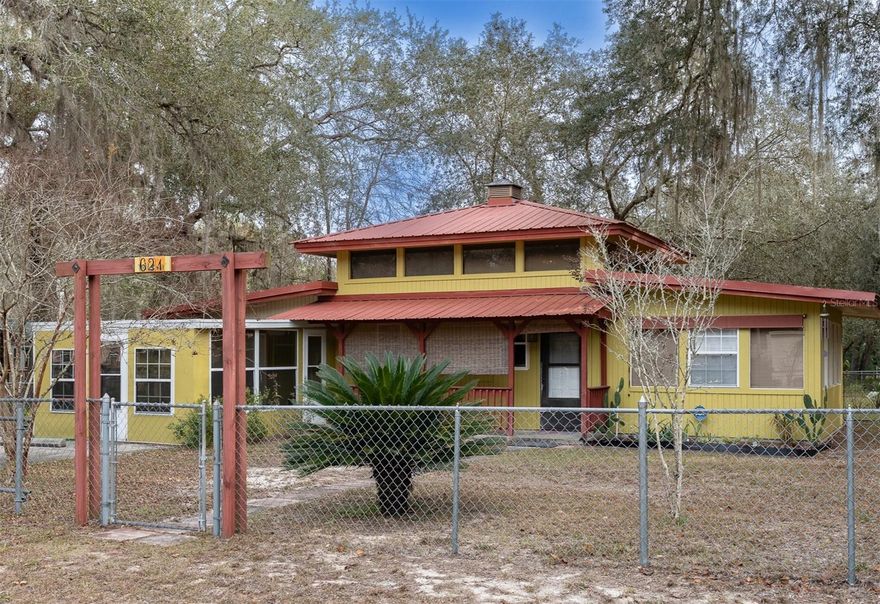 Year round affordable Forest Camp. If you’ve been searching for an affordable camp getaway in the Ocala National Forest, this is the kind of opportunity that doesn’t come around often. Set in a lake-access neighborhood near Lake Owen, this property offers the location buyers want, with the flexibility to use it your way. With over 1,100 square feet, 2 bedrooms, 1 bath, and bonus space, the layout gives you options. The home has received numerous updates including a 50-gallon hot water heater was installed in 2021, along with a 200-amp Siemens service panel (120/240V). The Goodman A/C unit was replaced in 2018. The septic system was pumped in 2022, and a new well tank, pressure switch, and pump switch were installed the same year. The interior of the home was freshly painted in 2022, electrical breakers were updated, and a new washer, dryer, refrigerator, and kitchen faucet were added. In 2023, a surge protector was installed at the meter by Clay Electric, all caulking and window sills were replaced, and new light fixtures and ceiling fans were installed throughout. The exterior of the home and both sheds were freshly painted in 2023, and a new metal roof was added to the 20 x 12 shed. Needs some updating, upgrades, and personal touches, but that’s exactly why it works so well as a camp or value-based purchase. Use it as a weekend retreat, Airbnb, seasonal escape, or a year-round home that fits your lifestyle and budget. The setting does the heavy lifting while you make it your own. Inside, you’ll find great natural light, a functional kitchen, and a layout that can easily be adapted. Outside is where camp life shines. The fully chain-link fenced and gated yard includes two storage sheds, room to spread out, and a concrete pad with RV parking and hookup. Bring the toys, invite friends, park the RV, and enjoy having a true base camp. Enjoy nearby lake access with a docking area and everything the Ocala National Forest is famous for. Hiking, boating, fishing, ATV riding, springs, and endless outdoor adventures are right outside your door. Silver Springs State Park is close by, offering kayaking, canoeing, swimming in crystal-clear springs, and miles of natural beauty. And when you want a beach day, Daytona Beach is just about an hour away. With no HOA, you have the freedom to enjoy your property. Convenient access to local shops and restaurants in the heart of Silver Springs make this location even more appealing. This is not a cookie-cutter home. It’s a solid, affordable camp property with room to improve and the kind of location buyers chase but rarely find at this price point. If you’ve been waiting for a place where sweat equity meets outdoor living, this could be the one. Schedule your showing and see the potential for yourself.