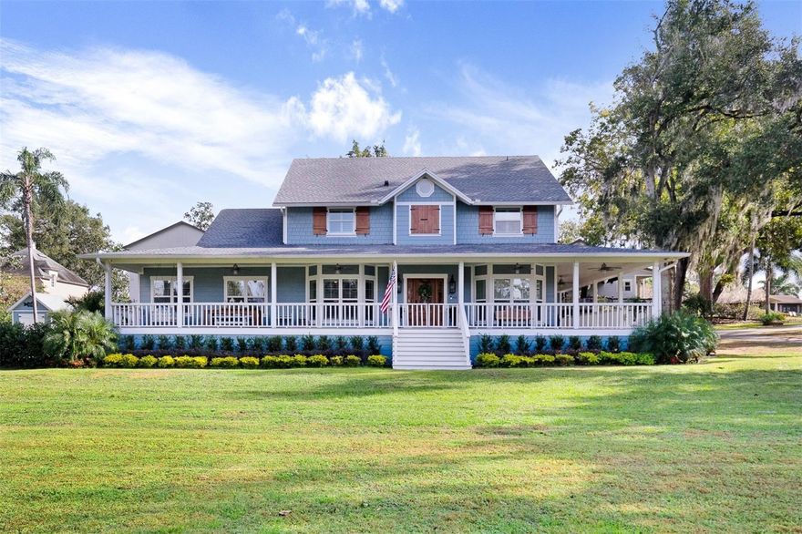 Beautifully renovated to the highest standards. Experience breathtaking Butler Chain LAKE VIEWS, SUNSETS and Disney FIREWORKS from the wide wrap around porch.  This iconic home was built on Palmer Park by one of Windermere’s Founding Families.  It remains recognized as a prime location in the heart of town.  New owners will add to and become part of the history. This delightful home basks in sunlight and evokes old Florida.  Wide plank wood floors, split shuttered windows, wood ceilings and custom millwork throughout.  The designer kitchen is focal in the open floor plan.  A quartz island has comfortable bar seating and apron cast iron sink.  Stunning mosaic tile walls frame custom cabinets.  There is a subzero refrigerator along with Viking appliances to include a six burner gas cooktop, built in French door oven, microwave, dishwasher and wine refrigerator.  The pantry is walk in with barn doors. The corner breakfast nook  views the garden. Glass doors open to an outdoor deck and fenced back yard. The primary bedroom suite is on the first floor.  It includes what is now a craft room, but could be used as an office, exercise room or nursery.  The bath features a soaking tub, rain head shower and luxury finishes.  The custom closet provides upper space for seasonal clothing. Also on the main floor is an office which could be a 4th bedroom.  A beautiful stairway leads to the second floor which boasts a large game room and media room with surround sound.  There are two additional bedrooms connected by a charming coastal bath. Another bedroom could easily be added.  All bedrooms are prewired for tv.  There are two tankless gas water heaters and Ring Security System.  A circular drive surrounds a fire pit … a perfect spot so sit around and enjoy the night time in Windermere. This is a town surrounded by The Butler Chain of Lakes, where golf carts are common and friendly neighbors will stop to chat on your front porch.  World’s apart but only minutes away from area attractions, fine dining, renowned golf courses and premium shopping.  Discover it now.  A great place to put your roots down and stay.