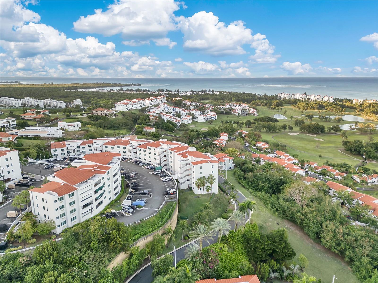 Experience refined tropical living at this ocean view penthouse in Vistas del Cacique Cluster VII, nestled within the gates of the Wyndham Grand Rio Mar Puerto Rico Golf & Beach Resort on the island’s East Coast.
This fully furnished 2,288 sq. ft. residence offers four bedrooms, each with its own bathroom. The primary suite includes a spacious walk-in closet and an en-suite bathroom. A convenient powder room is also available. The expansive kitchen and open terrace design create a seamless transition between indoor and outdoor living spaces.
For your convenience, the building features a full-power generator, a water cistern, and gated access. The property includes three parking spaces.
Additionally, the Wyndham Grand Rio Mar Resort offers beach access, oceanfront pools, a spa, a casino, a state-of-the-art gym, nine restaurants, shops, and tennis courts. Hotel guests can also enjoy two world-class, 18-hole golf courses.
The resort is ideally located just a short drive from the airport and San Juan. Rio Grande is known for El Yunque National Rainforest, its delectable cuisine, and its proximity to Carabalà Rainforest Adventure Park.