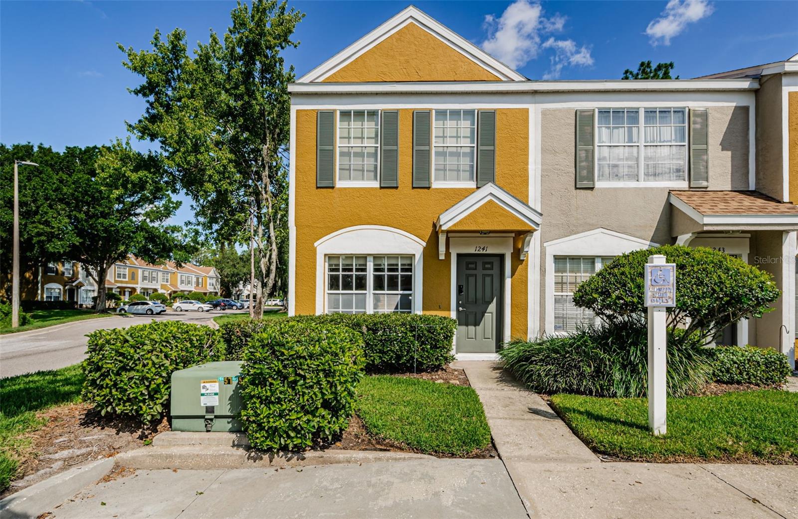 One or more photo(s) has been virtually staged. This corner unit is located in Meadow Pointe II, a gated community with large pool. This unit is a 2-bedroom, 1.5-bath townhome offers 1,184 sq. ft. There is a powder room on the first level and 1 large bathroom with tub between the spacious bedrooms on the second floor. The unit features tile flooring throughout and carpet in bedrooms, a screened lanai, and additional storage closet of lanai. The central A/C is serviced regularly, ensuring year-round comfort. The low HOA fee covers water, sewer, trash, exterior maintenance, and recreational amenities. Located near A+ schools and the Wiregrass Shopping Center, Wesley Chapel offers top-notch dining, shopping, and entertainment. Move-in ready and perfectly situated, this home combines convenience with a prime location. In close proximity to Pasco Hernando Community College and Hospitals. Assumable mortgage available with approval at 5% rate + transfer fees. 1 parking spot included directly in front of the unit and handicap spot as-well. Great investment property!