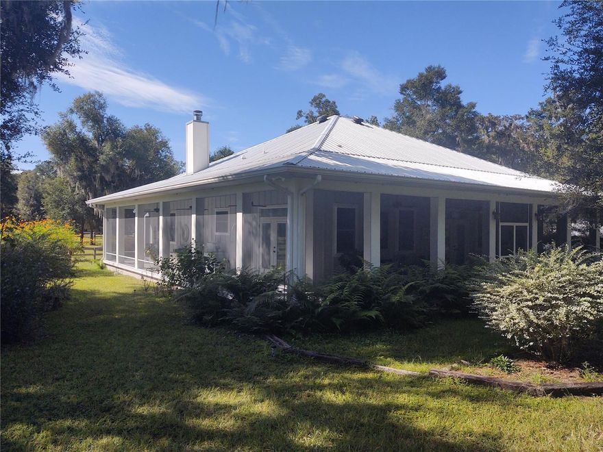 Designed after the DOGTROT style homes from the 1800's for functional design. Prior to air conditioning or electricity these homes were designed in warm climates to provide a cross breeze, brilliant architectural style. This is a modern replica in design of this style, with all the up to date amenities which results in low utility bills. Built in 2015 on a concrete slab reinforced with concrete exterior supports this home is here to stay, which also results in low insurance cost. There are French doors in every room which open out to the screened in wrap around porch, providing indoor/outdoor living. The eaves extend far out over the house protecting from sun and exposure to the elements. The actual roof covered footprint of the house is 3781 square feet, the heated square feet is 1875, leaving the porch at 1906. The metal roof is double insulated and painted with a reflective paint to ward against heat. Every step has been thoughtfully planned to comfortable living, pictures don't do it justice!! It is not actually certified , however, this house and footprint really falls into the PASSIVE house category. Located six miles to World Equestrian Center and nine miles to HITS, perfect location for the equestrian showing or conveniently located near multiple trailheads for pleasure riding. Pricing is dependent on the length of the lease and whether the property is rented as a whole (home + barn) or as the residence only, please reach out for more information!