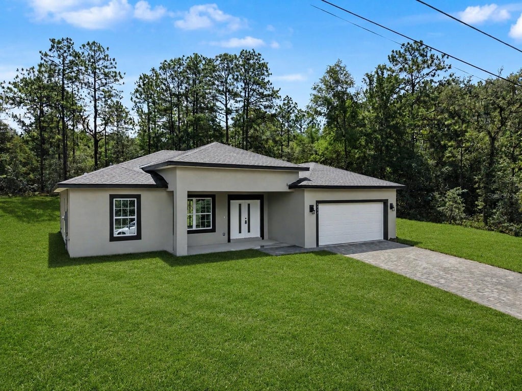 Photo of 7945 N Ibsen Drive, Citrus Springs, FL 34433 (MLS # TB8513849)
