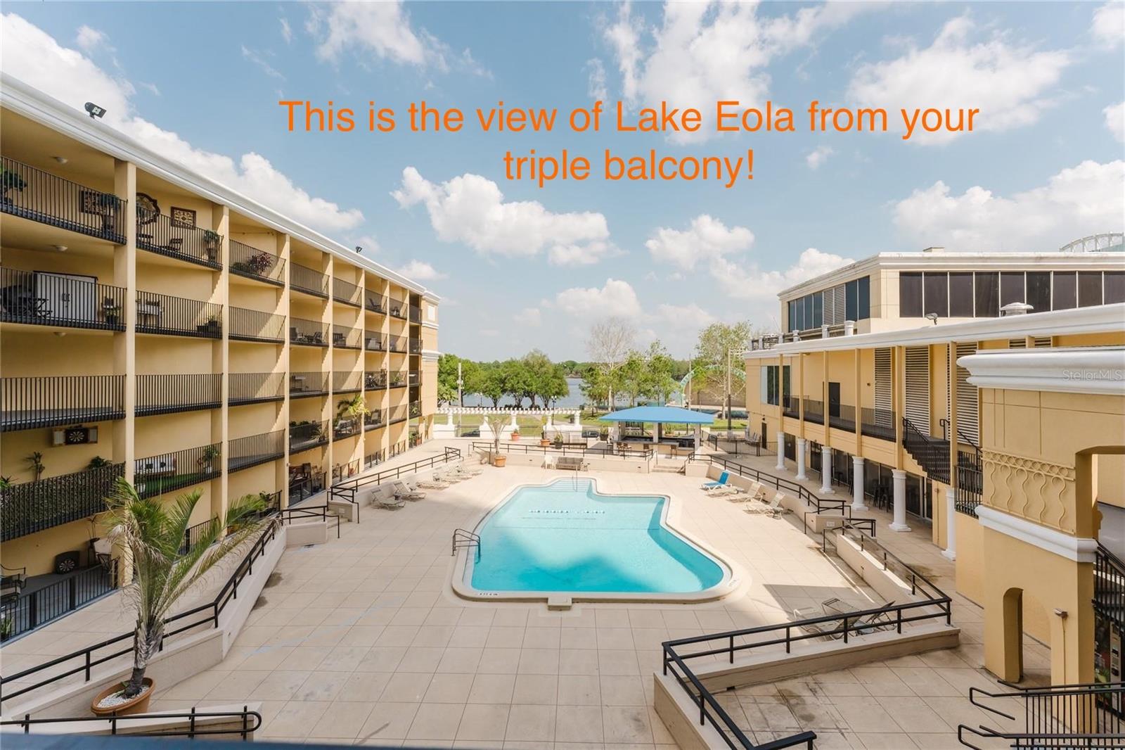 BEST VIEW OF EOLA FOR THE BUCK! DUAL PRIMARY SUITES! Updated kitchen and real hardwood floors in the main rooms. PLUS: Seller offering $5,000 credit to Buyer to upgrade bedroom flooring, or to help cover closing costs! Experience downtown living at its best with this beautifully designed 2-bedroom, 2-bathroom condominium facing Lake Eola with not one, but THREE PRIVATE PATIOS with stunning unobstructed views of the pool and The City Beautiful's Iconic Lake and city colorful bandshell!! It's like living in a resort 24/7 with direct pool access, an awesome gym, banquet hall for social gatherings, the building's own "I Love Orlando Cafe"...Then step out onto the streets where you can go for a walk or run around Lake Eola, enjoy all the city's festivities held in the park, and WALK EVERYWHERE in DTO: Co-working spaces, dozens of trendy restaurants, night life, church's, public and private schools...and all the main offices headquartered in Orlando are just steps from your casa. From here via car, you can get to virtually anywhere in Orange County in 30 mins or less, right in the middle of it all! You also have a SunRail station just blocks away to catch it north to Winter Park (5 mins) headed to Sanford (30 mins), or south to Sand Lake/Florida Mall (15 mins) headed all the way down to Poinciana...with connection plans to the airport and Brightline! The HOA fee covers water, pest control, sewer, trash removal, and a chilled water AC system that helps reduce energy costs, keeping your living expenses low (power is $50-75/month!). Recent addtl' updates include modern lighting, ceiling fans, new interior paint, and upgraded stainless steel appliances. A laundry facility is conveniently located on the first floor, with hook-up's also in one of the primary suites' closet, should you want to bring your own W & D. HOA initial buy-in is 4x the $760.50/monthly fee. You get 1 parking spot in the garage included. Financing is available!