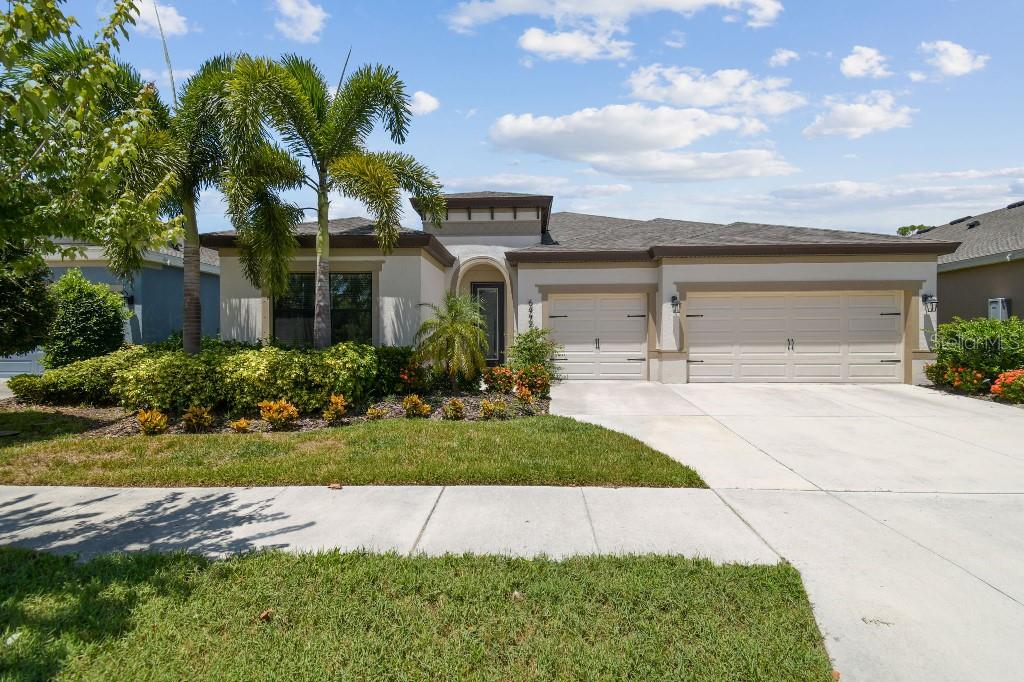 LUXURY LIVING AT ITS FINEST!! Welcome to Waterset, the latest Master Planned Community in Apollo Beach! This model-like home is located on one of the quietest and most sequestered streets in the neighborhood. The backyard has a covered porch with glass sliding door with doggie door insert, and large fenced-in yard, a safe and spacious place for pets and kiddos. Beautiful and cozy Gazebo, and Conservation area which means NO BACKDOOR NEIGHBORS! The home boasts a beautiful open-floor plan with Master Suite & Guest Suite (w/shower), secluded from the other 3 secondary bedrooms (one would make a spectacular office/study!). Roller shades & laminate (LVP) in all bedrooms & closets. Upgraded closets (reach-in & walk-in). Other upgrades in this gorgeous home such as wood-like staggered tile in the living area, Duraform Stone cabinets, quartz kitchen countertops, granite countertops in all the bathrooms, freshly satin painted walls, fashionable lighting throughout the house, custom-made wordly-wise wood wall in the family room (see pics, it's unbelievable!), wired SURROUND SOUND WITH SPEAKERS in main living area and SOLAR PANELS!! (Estimated Annual System Production is 16,098 kWh). Can you imagine life with NO ELECTRIC BILL? All main appliances are conveyed, including GAS Range, Microwave, Dishwasher, Refrigerator, customized Pantry with wooden countertop for small appliances. Modern front-load Washer & Dryer (gas) with pedestal. Quartz laundry countertop with stylish stainless-steel sink and faucet. Barn-door from laundry to master bedroom (providing privacy to owners). 3-car-garage with epoxy floor and attic-ladder to access storage space. Furnishings and Electronics available for sale. Enjoy all the wonderful amenities Waterset has to offer, including 2 pools with water slides, trails, fitness center, dog park, tennis & pickleball courts, Café & more! Schedule your Appointment TODAY and MAKE YOUR DREAM HOME A REALITY!