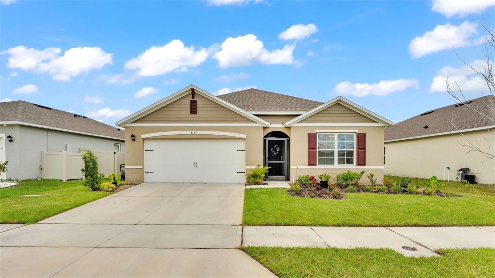 Welcome to this beautiful Cali floorplan located in the sought-after community of Riverstone! Located in one of the most calm, quiet, and peaceful areas of the community, you are sure to fall in love with this one! As soon as you enter the home, you are greeted by a long hallway, which makes the perfect space to add your own personal touch with photos and wall decor. The high ceilings enhance the spaciousness of this home, and there are plenty of windows to invite natural lighting into the space. This ensures you always feel comfortable in your home and that your guests always feel welcomed. The kitchen features gorgeous granite countertops, a large kitchen island ideal for preparing everyday meals, and a large walk-in pantry. There is also plenty of cabinet space and light cabinetry, which adds depth and a sense of luxury in this space. The primary bedroom is very spacious and features an already installed ceiling fan and the perfect view of the backyard from the large bedroom window. This room also features an en-suite bathroom. The beautifully remodeled shower was thoughtfully designed for accessibility and comfort. You will appreciate the spacious layout, slip-resistant flooring, and built-in bench that offers seated bathing convenience. The adjustable handheld dual shower head and strategically placed controls ensure ease of use. Stylish and functional, this shower blends modern design with essential accessibility features. This bathroom also offers gorgeous granite countertops, double sink vanity, private water closet, HUGE walk-in closet, PLUS an additional large closet! You will appreciate the fact that every bedroom is very roomy with plenty of space for storage. Through the sliding glass doors, you will be able to enjoy the covered, screened-in porch and fully fenced backyard. This will make a great area to entertain family and guests. You can spend your mornings here sipping your morning coffee or evenings reading a good book. Some other awesome features of this home include: smart home features, irrigation system, and security system. If you like some of the furniture, just ask! Sellers may be willing to leave some items for you. Not only is this house truly amazing, but so is the community! The Riverstone community features sidewalks for taking strolls, TWO community pools, playgrounds, a clubhouse, and even… a DOG park! Riverstone is a highly desirable community in a great location! It is about 2 miles from Publix and close to Lakeside Village as well. Residents of the community always look forward to the annual SUN 'n FUN airshow that takes place across the street. Being able to watch the airshow in the comfort of your own yard is definitely a major perk that always brings the community together. Call today to make this house your home!