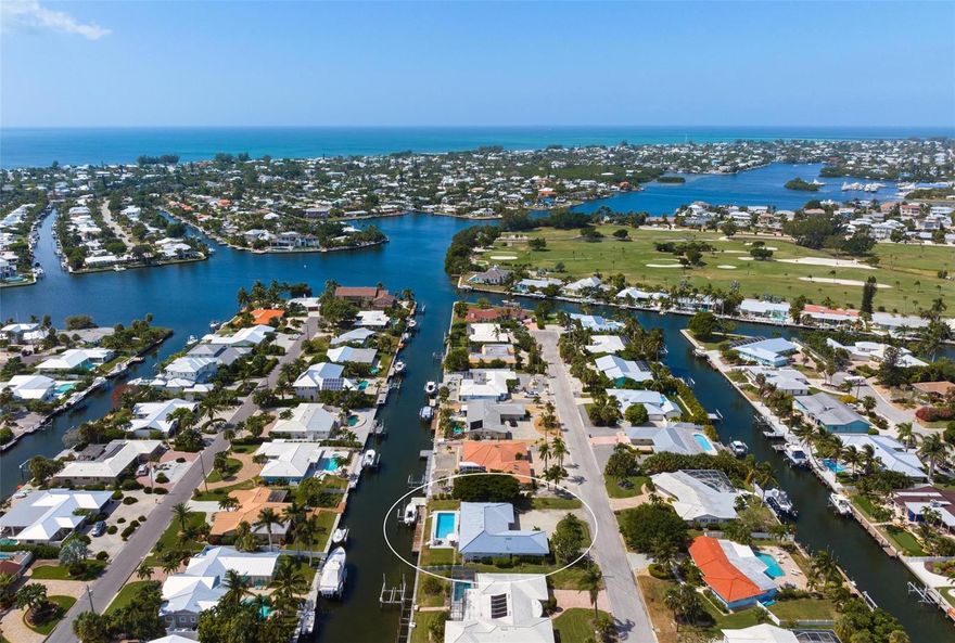 Key Royale canal front with 100 feet of waterfrontage! Make your island dreams come true in this beautifully remodeled and turnkey furnished waterfront pool home with nearly 2,000 square feet of living space. This property is currently used as a monthly rental, rental history available upon request. Property is situated on an 11,500+ square foot lot with 100 feet of waterfront, located on a deep-water canal in the exclusive and highly sought-after Key Royale waterfront community. The well-maintained property offers a long dock with a 10,000-lb boat lift and direct access to Tampa Bay and the Gulf of Mexico. The 3-bedroom, 2-bathroom home features a lovely split floor plan with a primary bedroom featuring a spa bath and dual vanity. The well-appointed newly remodeled kitchen features an island and stainless appliances! Glass sliders lead to the canal-front pool and lush landscaping. Newly installed impact-resistant windows and doors are found throughout the home along with easy-to-maintain flooring. Other highlights include a newer tile roof (2013), a large pool, a 2.5-car garage for plenty of storage or a golf cart, and an expansive circular driveway for added parking. You will be just a golf cart ride away from Anna Maria Island’s beautiful beaches and all points of interest to enjoy the island lifestyle! Enjoy taking off on your boat right from your backyard into open water with no bridges for amazing sunset cruises every night. Call today for your private showing.