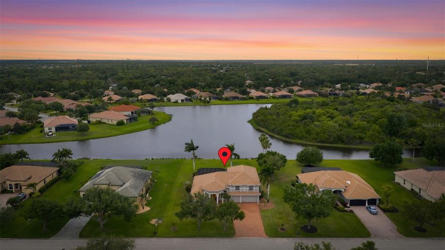 Welcome to Country Meadows—where space, privacy, and waterfront living come together in one of Bradenton’s most desirable communities. Situated on an expansive ¾-acre lot, this 5-bedroom, 4-bathroom residence offers a rare opportunity to enjoy a spacious homesite with peaceful water views and a functional, well-designed layout.
A large paver driveway provides ample parking and leads to an impressive double 8-foot entry. Inside, you’re greeted by a light-filled interior with an open floor plan, volume ceilings, and a dramatic 22-foot ceiling in the main living area, creating a bright and airy feel throughout the home.
The kitchen is centrally located and designed for both everyday use and entertaining, featuring stainless steel appliances, solid surface countertops, 42” wood cabinetry, and a generous breakfast bar that overlooks the family room. A dedicated breakfast nook with an aquarium window offers additional dining space and brings in natural light while framing views of the backyard and water beyond.
The primary suite is located on the first floor and offers a private retreat with dual walk-in closets and an en-suite bathroom complete with dual vanities, a garden tub, and a separate shower. Also on the main level is an additional bedroom and full bathroom, providing flexibility for guests, a home office, or multigenerational living.
Upstairs, you’ll find three generously sized bedrooms, along with two additional full bathrooms, including one ensuite. The layout offers both privacy and functionality, making it well-suited for a variety of living arrangements.
Outdoor living is a standout feature of this home. The screened lanai overlooks a pool and spa, all set against a tranquil waterfront backdrop. The oversized lot provides additional space between neighbors and enhances the sense of privacy, while offering plenty of room to enjoy Florida’s year-round outdoor lifestyle.
Country Meadows is known for its larger homesites, low HOA fees, and no CDD fees. The community is conveniently located near top-rated schools, shopping, dining, and provides easy access to the Gulf beaches, including Anna Maria Island, as well as major roadways for commuting.
This property presents a unique opportunity to own a spacious waterfront home in a well-established Bradenton community.