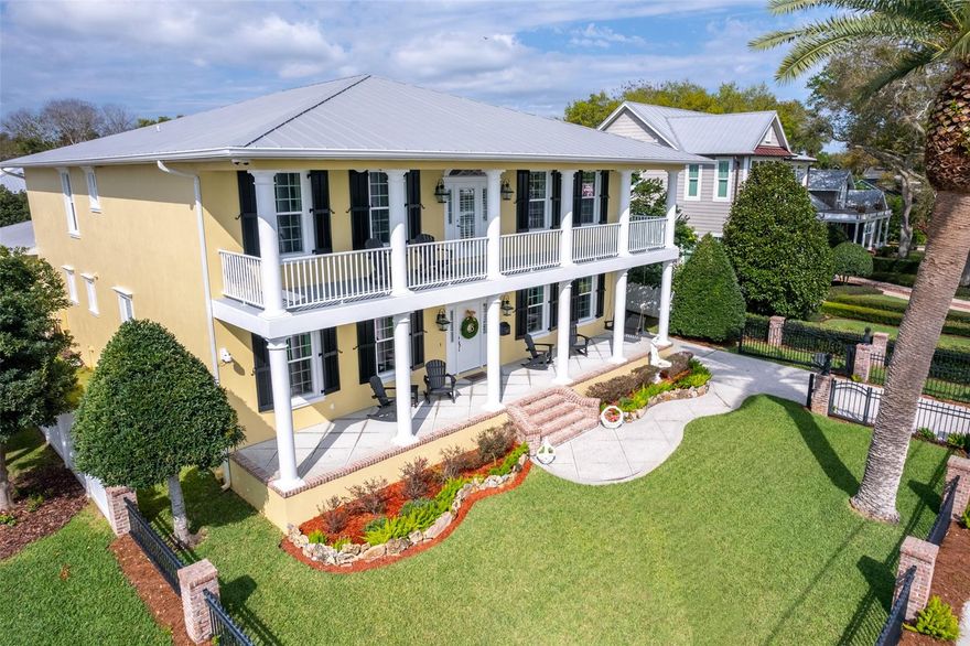 Rare chance to own a stately custom built home in the sought after Riverside Drive section of New Smyrna Beach with a private 2 slip boat dock on the water! Pull into the gated property and be amazed by this stunning well maintained 2012 built home. No details were spared in this timeless design with high end finishes. The exterior of this home has a solid concrete poured front and back porch, smooth finish stucco, brick steps, custom designed fencing and gate, a commercial gate operator, fiberglass colonial shutters by Atlantic Shutters, a standing seam metal roof, and boat lift in the boat house that will hold up to 7,000-10,000 lbs. This home offers 4,653 Living Sq Ft, 4 bedrooms, 3 bathrooms, plus a complete in-law suite with its own kitchen, bathroom, living room, and dining space. The in-law suite has its own entrance through the garage and also through the primary bedroom suite closet perfect for taking care of a family member.  The home features a formal living and dining room, informal dining space and open to the great room. White oak flooring with custom lengths and widths. The luxury kitchen is equipped with custom cabinets, pull-out drawers, honed marble counters, gas range, hand glazed tile backsplash, pantry and a handmade custom light fixture. Downstairs there is also a guest bedroom and full bathroom, upstairs you will find 2 guest bedrooms with a jack and jill bathroom and the primary suite. The primary suite is large with an additional office/workout room, walk in shower, soaking tub, spacious 19’10” x 7’6" walk in closet and balcony overlooking the intracoastal waterways of the Indian River. Additional upgrades: Closed-Cell Icynene Insulation in the exterior walls and ceilings, extra insulation between the in-law suite and the primary home, gas tankless hot water heater, outdoor shower, new exterior paint in 2020, 3 inside washer and dryer hookups and a fully fenced yard perfect for your pets. 3 car garage!  This is the ultimate lifestyle estate! ;Water: City