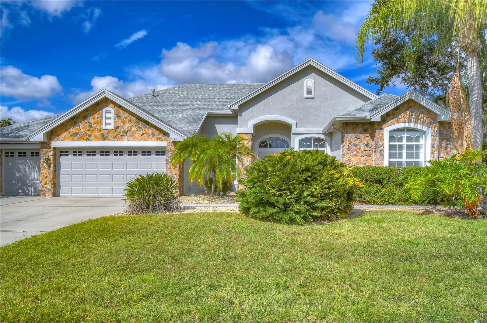 One or more photo(s) has been virtually staged. Tucked away in the peaceful, gated community of Fox Wood, this magnificent 2-story pool home is located in the highly sought-after Cameron’s Point section—offering quiet privacy, less traffic, and a true neighborhood feel. With a beautiful park right next door, it feels like you have one giant backyard, perfect for kids to play. Zoned for Trinity Oaks Elementary, Seven Springs Middle, and J.W. Mitchell High—all just minutes away—this is a home your family can grow into from kindergarten through graduation. Featuring 4 spacious bedrooms, a den, 2 living areas, a bonus room, and a huge loft upstairs, there's space for everyone to spread out or come together. The open-concept kitchen is a chef’s dream with gas cooking, a double oven, tons of storage, a hidden walk-in pantry, and a built-in desk—perfect for homework or recipes—flowing right into the cozy family room and breakfast nook with peaceful backyard views. The primary suite feels like a retreat, with sliding doors to the pool, two closets, and a luxurious bathroom with a soaking tub. The split layout offers ideal flexibility for multigenerational living or guests, with the fourth bedroom and private bonus room tucked off the main living area near the third full bath. Upstairs, a spacious loft and an additional bathroom provide endless possibilities—playroom, office, or even extra bedrooms. Step outside to your private oasis: a screened-in, heated saltwater pool and spa, a relaxing lanai, and a large side yard with a playset—plus direct access to the park next door. Add in the neighborhood playground, walking trails, and the exciting 800+ acre sports complex coming soon to Trinity, and this location is hard to beat. Not in a flood zone and packed with recent upgrades including a new roof (2021), saltwater pool system and pump (2025), two AC units (2021 &2024), central vac (2022), water heater (2015), and a water softener system—this home is move-in ready and built for everyday life. Come see it for yourself—this is more than a house, it’s where your next chapter begins.