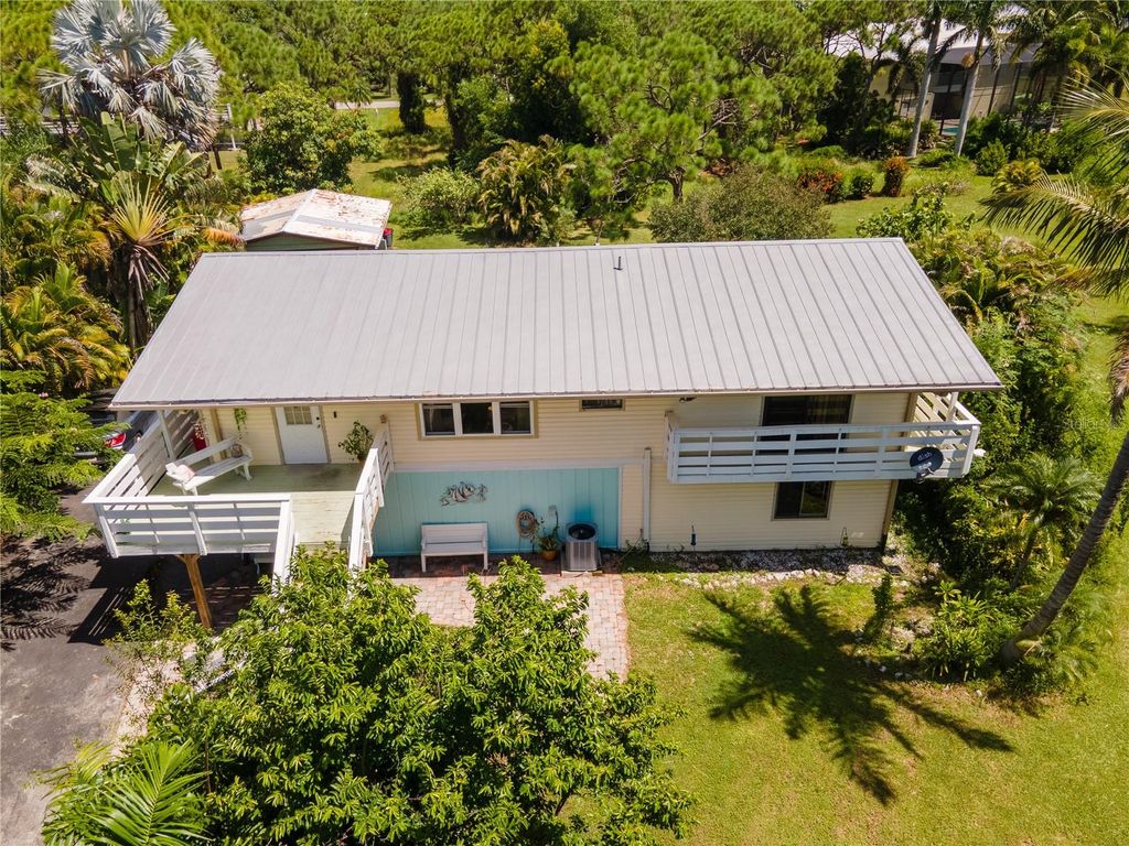 Photo of 10600 Habitat Trail, Bokeelia, FL 33922 (MLS # O6355890)