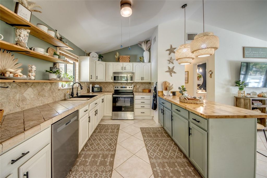 Photo of 10600 Habitat Trail, Bokeelia, FL 33922 (MLS # O6355890)