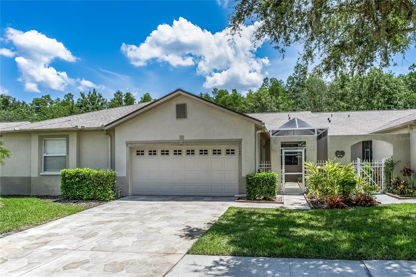 Pristine villa-Price improvement! Nature Views in The Groves Golf & Country Club – Active 55+ Living in this vibrant gated community!
Welcome to your Florida retreat! This beautifully maintained villa offers a 2-bedroom, 2-bath layout with a closed-in Florida sunroom that overlooks the peaceful nature preserve—no rear neighbors and just steps from green space in this golf cart-friendly community.
Enjoy a charming front screened-in garden patio with a covered porch entryway that sets the tone for the open and inviting interior. Inside, you’ll find a bright, open floorplan featuring a spacious kitchen with ample cabinets and counter space, a breakfast nook, bar seating, and a solar tube for added natural light. The dining room features a tray ceiling, and the living room is light-filled with another solar tube, flowing seamlessly into the relaxing Florida room.
Step out to your private, fully screened-in lanai—perfect for entertaining or enjoying the serene preserve views.
The primary suite offers a bay window, private access to the Florida room and lanai, a walk-in closet, and an en-suite bath with dual sinks, walk-in shower, and a solar tube for natural light. The guest bedroom overlooks the front courtyard and is located near the second full bath for privacy and comfort.
Additional features include a spacious garage with laundry area, extra storage, and a dedicated storage room. ROOF 2023, top of the line Daikin A/C 2024, WATER HEATER 2024
Live the good life in The Groves Golf and Country Club, a gated 55+ community with an 18-hole golf course, driving range, tennis, pickleball, bocce, shuffleboard, and a dog park. The Clubhouse features a restaurant, fitness center, library, and a resort-style pool and spa.
The HOA fees includes roof replacement, exterior paint, cable tv, internet and yard work.
Conveniently located near shopping, restaurants, and major roads to Tampa and more—with Publix, restaurants, banks, and more just outside the community gates.