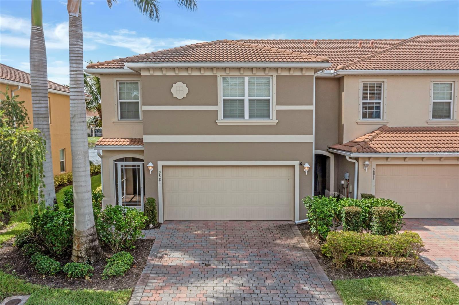 Welcome to this beautifully updated 3-bedroom, 2.5-bath townhome with a loft, located in the highly desirable, gated community of Lindsford. Offering the perfect blend of modern upgrades, functional space, and serene water views, this home is a rare opportunity in a prime Fort Myers location. From the moment you step inside, you'll notice the attention to detail—from the freshly painted interior to the upgraded flooring, which includes sleek tile on the main level and brand-new carpeting upstairs and on the staircase. The spacious open-concept layout flows effortlessly from the living and dining areas into the kitchen, creating a bright and inviting space for everyday living and entertaining. The kitchen is well-appointed and features new appliances, including a washer and dryer, making this home move-in ready. The living space extends outdoors with a covered lanai that overlooks a tranquil lake and fountain—perfect for relaxing evenings and morning coffee. Slider doors with a new locking system and roller track, plus custom lanai and slider shades, add both style and ease. Upstairs, you'll find all three bedrooms plus a large loft—a flexible second living area ideal for a home office, playroom, or media space. The generous primary suite includes a spacious walk-in closet and ensuite bath. Additional upgrades include new plantation shutters throughout, a new garage door opener with keypad and smartphone app control, new A/C coils, and updated light fixtures and ceiling fans—some equipped with dimmers for customizable ambiance. Lindsford offers resort-style amenities, including a community pool, all within minutes of shopping, dining, downtown Fort Myers, Twins Stadium, RSW Airport, and the beautiful Gulf Coast beaches. With its thoughtful updates, peaceful lake view, and unbeatable location, this townhome is ready to welcome you home.