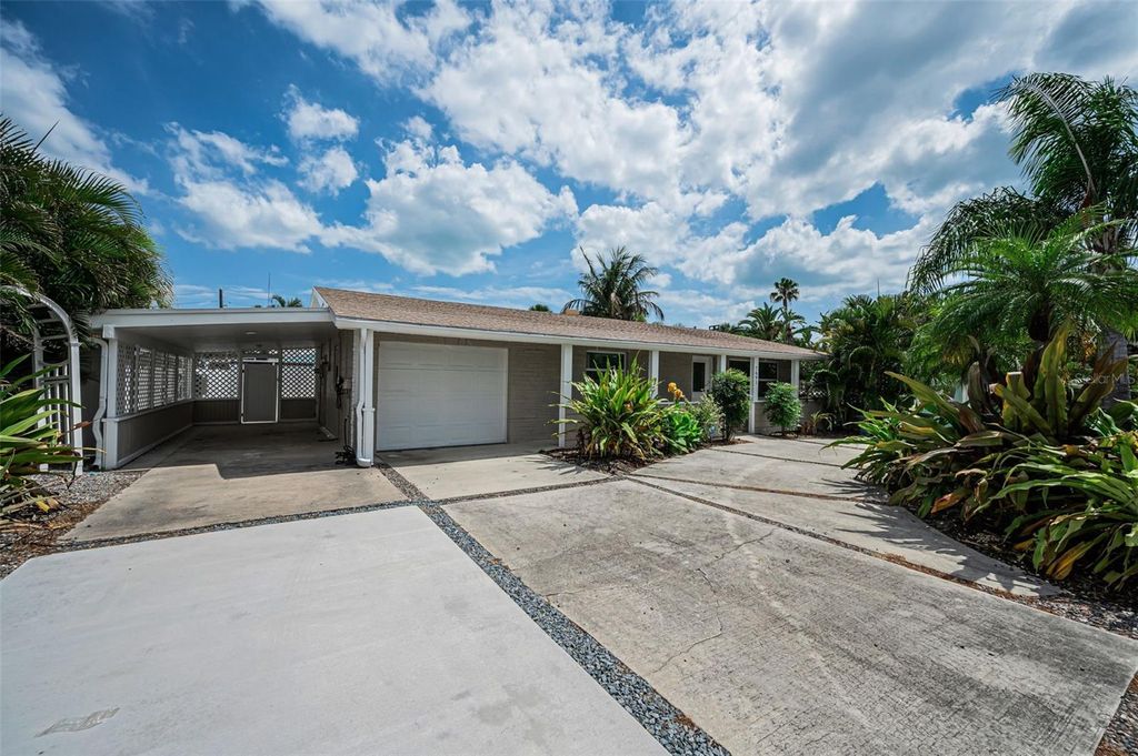 Photo of 7691 Coquina Way, St Pete Beach, FL 33706 (MLS # TB8499113)