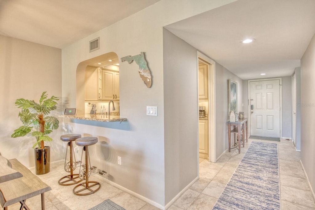 Photo of 5640 Golf Pointe Drive #101, Sarasota, FL 34243 (MLS # TB8488837)