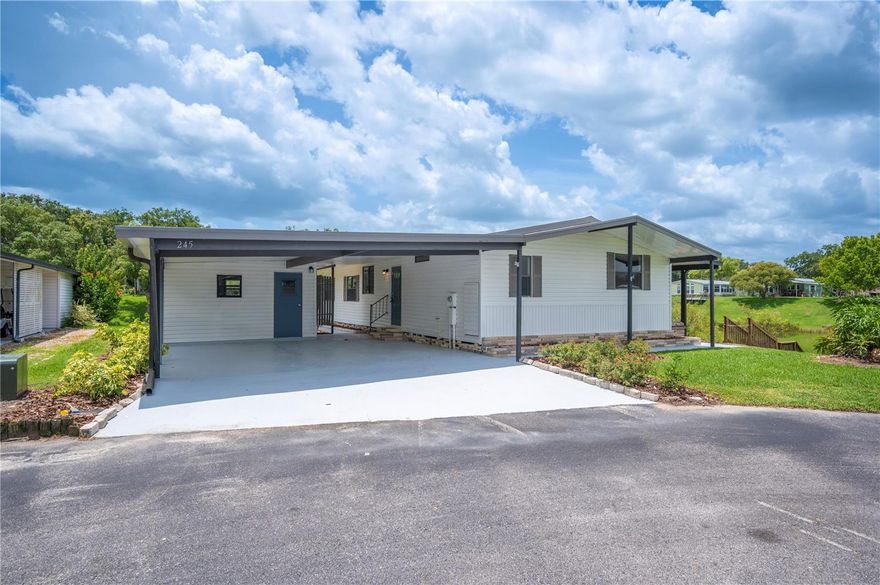 Welcome to your dream home in the highly sought-after Floral Lakes 55+ community, where comfort meets elegance and every detail has been thoughtfully updated. Located on a premium cul-de-sac lot with water on two sides, this beautifully renovated home offers serene lake views from nearly every angle.
Step inside to discover a completely updated interior, featuring all new flooring, a brand-new A/C system, and a new electric tankless water heater for maximum comfort and efficiency. The spacious living room, centered around a cozy fireplace, flows seamlessly into the dining area—perfect for entertaining or quiet evenings at home.
The brand-new kitchen is a true showstopper, featuring stainless-steel appliances, sleek new countertops, new cabinetry, and a convenient laundry room just off the kitchen for added functionality.
Retreat to the oversized primary bedroom, a peaceful sanctuary with expansive bay windows overlooking the lake, two generous walk-in closets, and a luxurious en suite bathroom complete with dual sinks, separate vanity space, and plenty of room to unwind.
Enjoy Florida living at its finest from your covered back porch, the perfect spot for morning coffee or sunset views over the water. Additional exterior highlights include a metal roof, 2-car carport, and fresh new landscaping.
This home sits on one of the best lakefront lots in the community, offering both privacy and incredible views in a quiet cul-de-sac location.
Community amenities include a sparkling pool, shuffleboard courts, a clubhouse, boat ramp, and more—designed to support an active and social lifestyle.
Don’t miss this rare opportunity to own a move-in-ready lakefront gem in Floral Lakes. Schedule your private showing today!