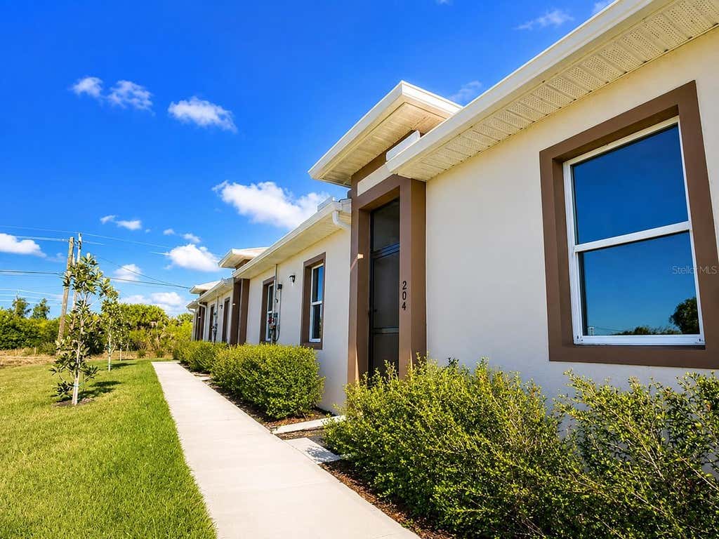 Photo of 289 Boundary Boulevard #204, Rotonda West, FL 33947 (MLS # TB8533243)