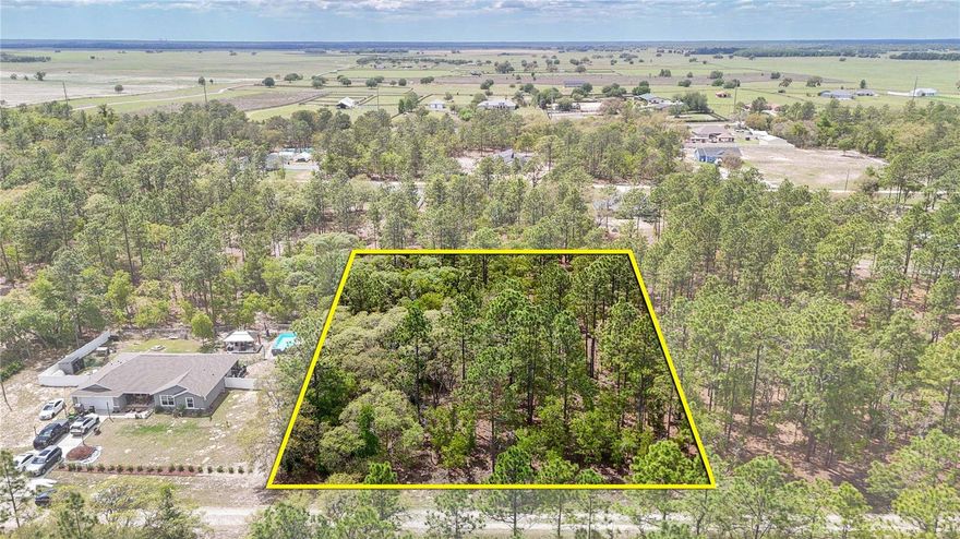Discover the perfect blank canvas for your dream home on this sprawling 1.16-acre lot in the tranquil Rolling Hills community. This oversized residential parcel offers a peaceful, countryside atmosphere while remaining in close proximity to the world-famous Rainbow Springs State Park and the World Equestrian Center. High, dry, and ready for your vision, this R-1 zoned lot is surrounded by lush landscapes and newer homes. With no mandatory HOA fees, you have the freedom to build and live your way. The property is easily identifiable by the 2x4 wood stakes placed at the corners and is located directly across from house #6990 and to the left of house #7015. Drive by today to experience the peace and quiet of this beautiful homesite—your Florida lifestyle starts here!
