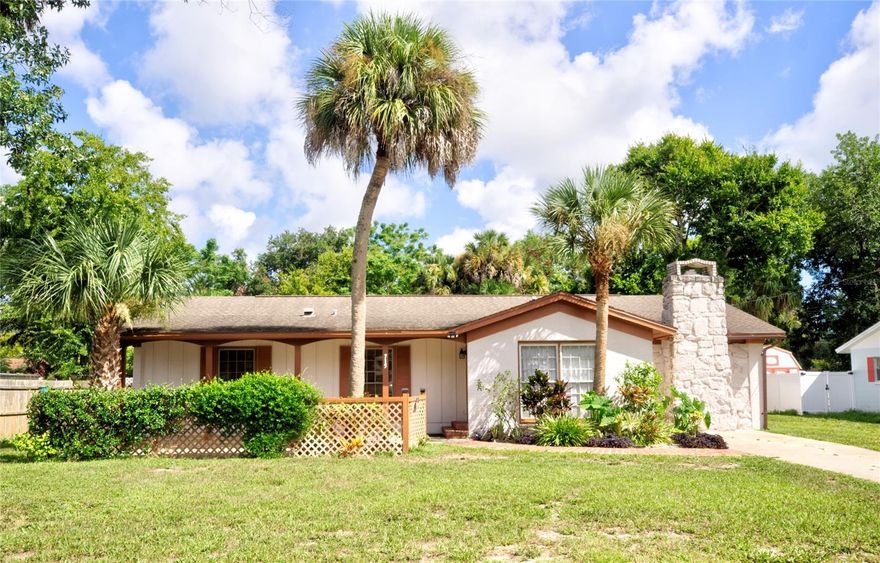 Don't miss out on this great opportunity! Well-maintained and upgraded home including detached 1.5 car garage/workshop centrally located in charming New Smyrna Beach less than 3 miles from beach, golf courses, shopping, restaurants, river, public boat ramps, public and private schools. Sturdy block and brick constructed 4 bedroom, 1.5 bath, separate dining and family rooms, wood burning fireplace (cleaned 2021), NO HOA!! Enjoy a huge privacy fenced lot with plenty of space for pets, toys, parking, plenty of room to expand or add pool. Detached block garage/ workshop 23’ x 16’8” with new electric sub panel. In 2021 installed new granite kitchen countertops, sink, pull down faucet, cooktop, microwave/grill.  Kitchen can easily be expanded by removing wall.  Beautiful LVT flooring and baseboards throughout over terrazzo floor, bathroom vanities, faucets, ceiling fans & lighting; In 2019 installed new hurricane windows with transferable lifetime warranty, A/C heat pump & large water heater, exterior / interior paint & gutters; 2018 new electric panel, fire alarms, outlets & wood fencing. Covered front porch entry, back porch, lots of fruit trees. Move-in ready. Motivated seller! ;Water: City