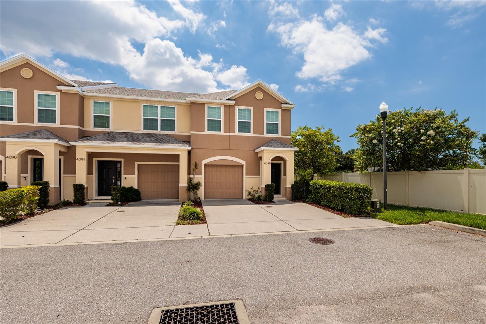 Welcome to The Village of Park Place! This beautifully maintained CORNER townhouse offers a low-maintenance lifestyle in a prime Pinellas County location. Inside, you’ll find a bright and spacious open-concept layout with an oversized living area and a kitchen featuring granite countertops, tall wood cabinets, and stainless steel appliances. Triple sliding glass doors lead to a large screened lanai overlooking a peaceful, grassy open space—perfect for relaxing or entertaining. The main level includes neutral tones, tile flooring, and a convenient half bath. The primary suite includes a large walk-in closet and en-suite bath with dual sinks and a walk-in shower. The two guest rooms are set apart for privacy and share a full bath. A second-floor laundry room with washer and dryer adds convenience. Additional features include a one-car garage with door opener. The HOA covers all exterior grounds maintenance, and the community did not experience flooding during recent hurricanes. Close to Gulf beaches, Parkside Shopping District, Downtown St. Pete, dining, airports, and a new youth park—this move-in-ready home has it all. Don’t miss out—schedule your showing today!