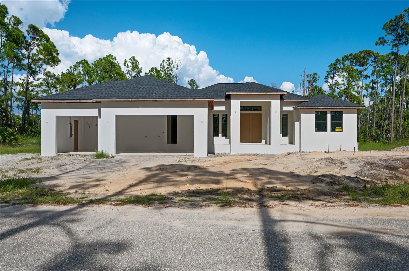 Under Construction. Step into your Florida paradise with this stunning custom-built home raised on 4 course stem wall and 3 car wide driveway, perfectly situated on a DOUBLE LOT along a serene WATERWAY CANAL! This spacious residence boasts 2,588 sq ft of luxurious living space and 3,738 total sqft, featuring 4 bedrooms, 3 bathrooms, 3-car garage—ideal for both comfort and convenience. Crafted with attention to every detail, this home offers exquisite upgrades throughout. Revel in soaring custom high ceilings, smooth stucco finishes, and custom 48"x48” porcelain tile flooring. The chef’s kitchen showcases beautiful quartz countertops and a custom-built design that elevates both form and function. The expansive lanai is an entertainer’s dream, offering ample space for outdoor living—whether you're grilling, lounging, or relaxing by the water. Something to the effect of this magnificent custom home is waiting for you to put the finishing touches. Get this house under contract now you can pick your colors and if you want a pool, you can design whatever pool you like. You can hire the builder to put in your custom pool or any pool designer you choose. If you're not interested in a pool and want a huge lanai enclosed, this house is perfect for you. Don't miss this rare opportunity to own a luxurious home where every detail has been meticulously crafted for your ultimate Florida lifestyle. Home is to be estimated to be completed by November 2025!