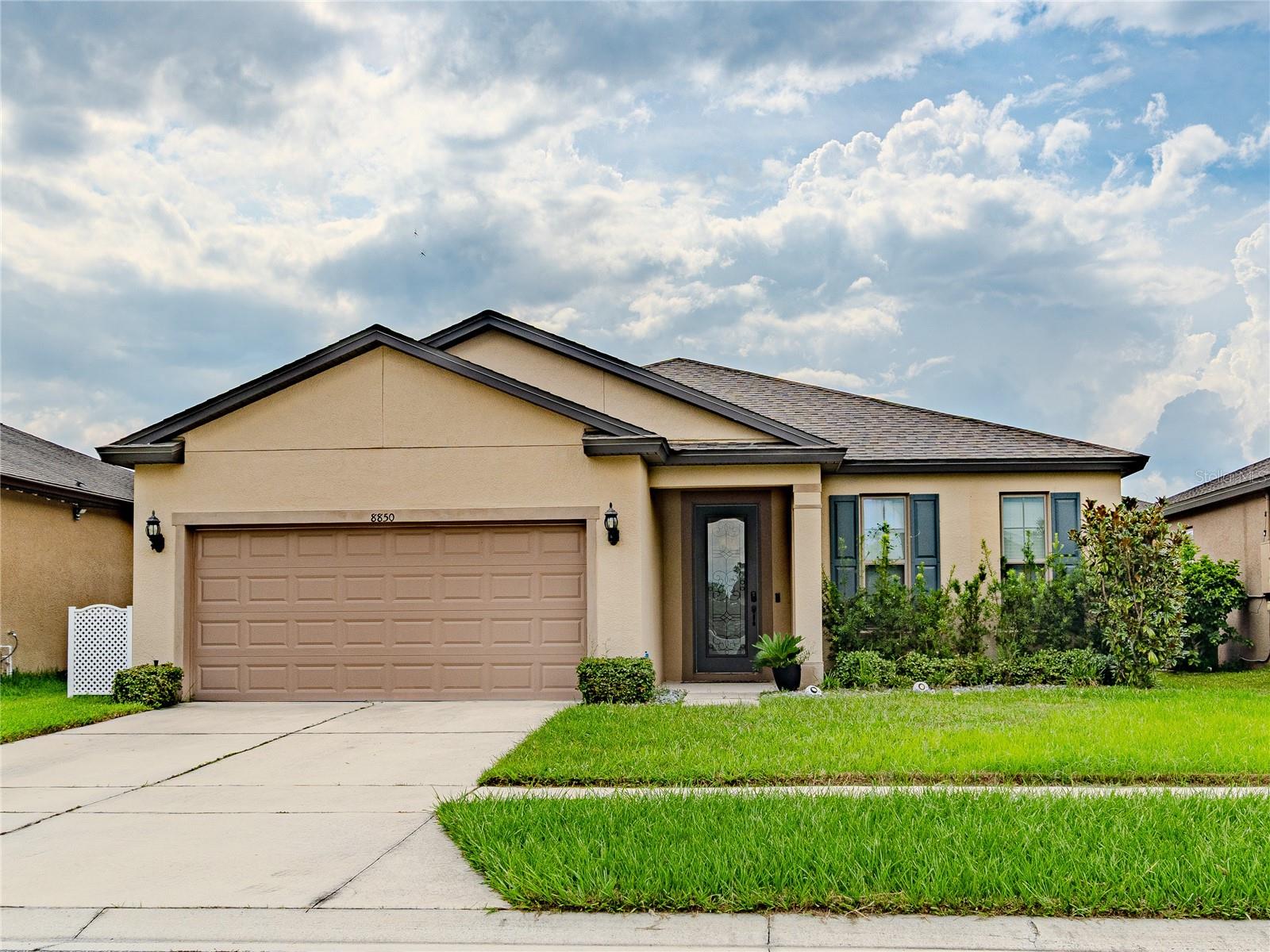 Only 6 years old! Check out this beautiful well maintained 2019 home nestled in Polk City just 5 minutes from I-4. The main entry is equipped with its own built in combo entry lock for convenience.
Your new home is less than 15 minutes from downtown Lakeland, approximately 25 minutes west of Disney, 35 min east of Tampa, your future home is conveniently centrally located. This cozy home boasts a spacious open floor plan with a large multi-purpose den/flexible room upon entry. The open floor concept displays the elegant island kitchen which flows smoothly into the dining and living room areas. Tile flows throughout while carpet is featured in the bedrooms. The primary suite has its own primary suite bathroom with dual sinks. All appliances will stay, including the washer and the dryer in its separate laundry room. The fence only needs 2 side gates installed for the backyard to be fully fenced. Zoned for Tenoroc High School, they feature a brand new college level track and field! This home is priced to sell quickly! Call for your showing today
