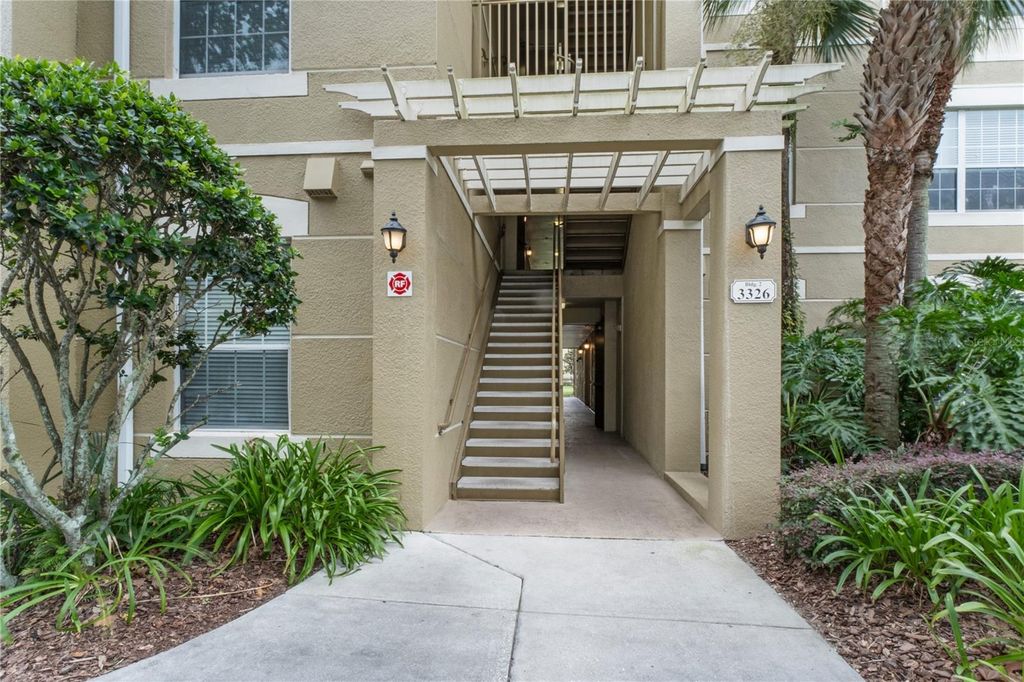 Photo of 3326 Robert Trent Jones Drive #305, Orlando, FL 32835 (MLS # O6399087)